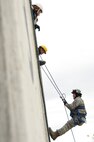 U.S. Air Force Master Sgt. Timothy Schitker a firefighter with the 180th Fighter Wing rappels down the side of a training facility at the Toledo Fire and Rescue Department Training Academy, October 5, 2010.  Firefighters from the 180th Fighter Wing are participating in six days of training designed to prepare them for various rescue situations. (U.S. Air Force photo by Senior Airman Amber Williams/Released)