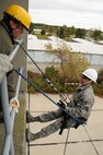 U.S. Air Force firefighters from the 180th Fighter Wing rappel down the side of a training facility at the Toledo Fire and Rescue Department Training Academy, October 5, 2010.  Firefighters from the 180th Fighter Wing are participating in six days of training designed to prepare them for various rescue situations. (U.S. Air Force photo by Senior Airman Amber Williams/Released)
