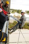 U.S. Air Force Airman 1st Class Devin VanGorder a firefighter with the 180th Fighter Wing rappels down the side of a training facility at the Toledo Fire and Rescue Department Training Academy, October 5, 2010.  Firefighters from the 180th Fighter Wing are participating in six days of training designed to prepare them for various rescue situations. (U.S. Air Force photo by Senior Airman Amber Williams/Released)
