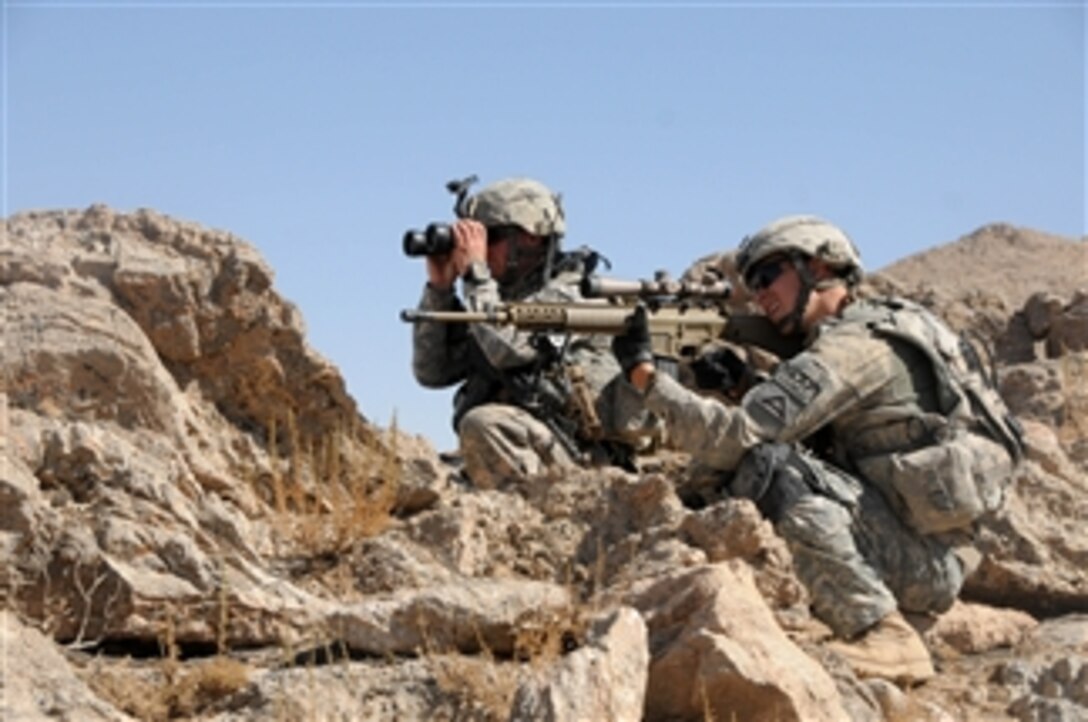 U.S. Army soldiers with Charlie Company, 1st Battalion, 4th Infantry Regiment look for suspicious activity from an observation point during an area reconnaissance mission off Highway 1 in Zabul province, Afghanistan, on Oct. 1, 2010.  