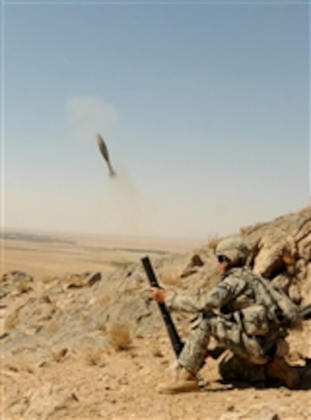 A U.S. Army soldier with Charlie Company, 1st Battalion, 4th Infantry Regiment fires a mortar round during an area reconnaissance mission off Highway 1 in Zabul province, Afghanistan, on Oct. 1, 2010.  