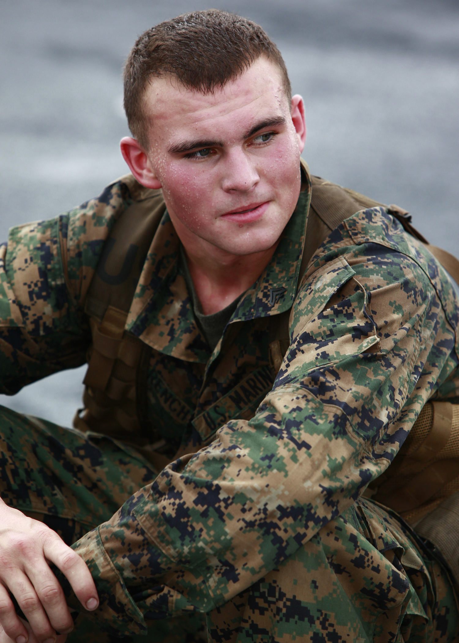 U.S. Marine Cpl. Timothy A. French, from Tilton, N.H., with Company A, 2nd Assault Amphibian Battalion, attached to Special-Purpose Marine Air-Ground Task Force Continuing Promise 2010, rests during a 10-minute break while conducting a six mile hump with pack and weapon, aboard amphibious assault ship USS Iwo Jima (LHD7), off the coast of Chiriqui Grande, Panama, Oct. 7, 2010. Service members and civilians are deployed in support of CP10 providing medical, dental, veterinary, engineering assistance and subject-matter exchanges to Caribbean, Central and South American nations.