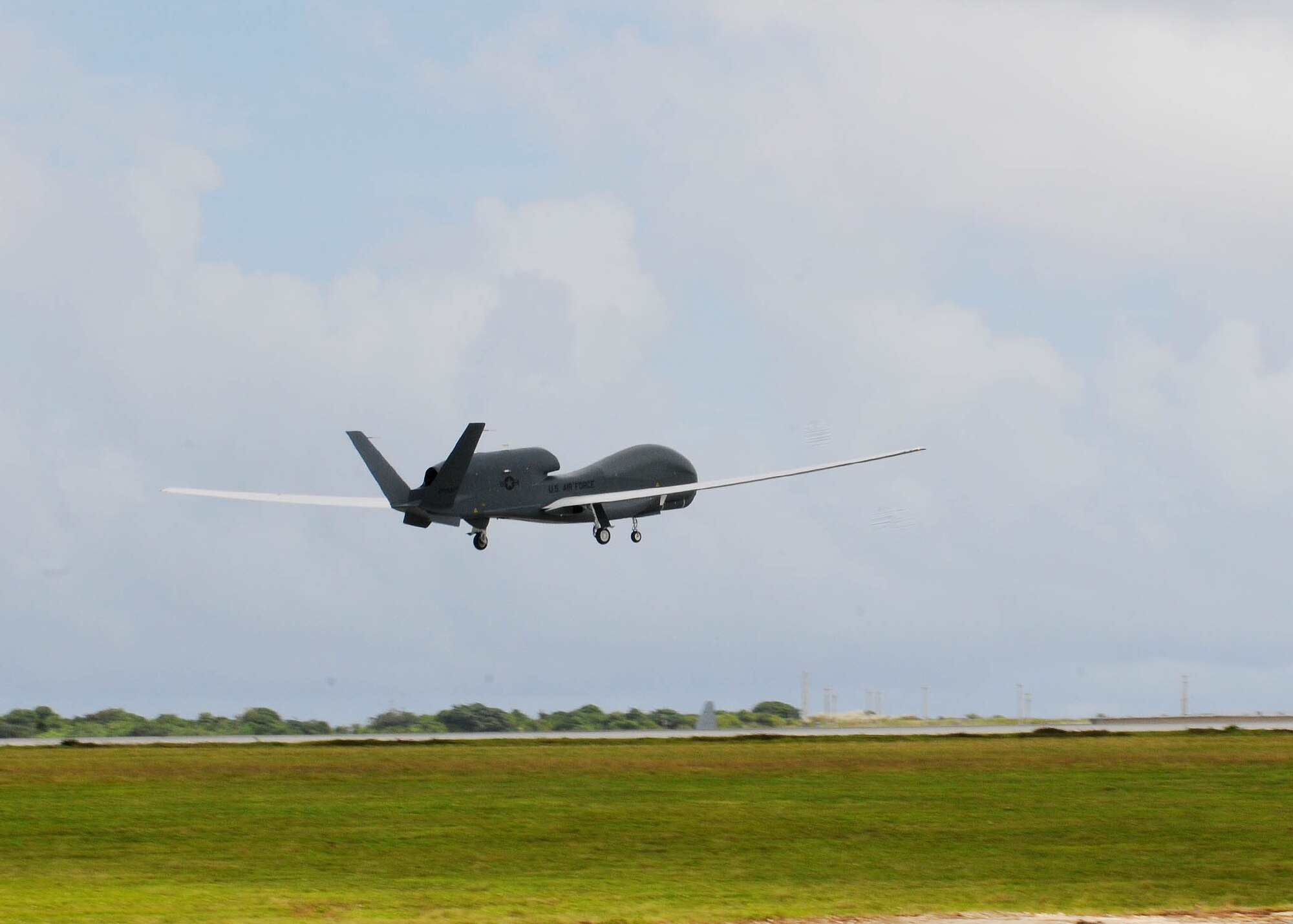 The RQ-4 Global Hawk Andersen Air Force Base, Guam, Oct. 7. This is its first take-off since its arrival ceremony and it's the only permanentlystationed aircraft on Andersen. The Global Hawk's mission is to provide a broad spectrum of intelligence, surveillance and reconnaissance collection capability to support joint combatant forces in worldwide peacetime, contingency and wartime operations. (U.S. Air Force photo/ Senior Airman Nichelle Anderson/released)  
