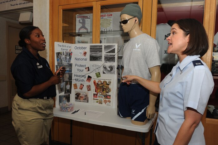 NELLIS AIR FORCE BASE, Nev.-- Capt. Tammy Baker (right), chief audiologist with 99th Medical Group, explains the effects of different decibel levels to Staff Sgt. Erin Jackson (left), fitness center craftsman with the 99th Force Support Squadron, at the Nellis Fitness Center Oct. 7. Using "Jolene", a mannequin specially designed to measure decibel levels, Captain Baker explains the effects that headphones have on the hearing. October has been designated National Protect Your Hearing Month. Contact your Primary Care Manager at the Michael O'Callaghan Federal Hospital for a hearing exam. (U.S. Air Force photo by Senior Airman Brian Ybarbo) 