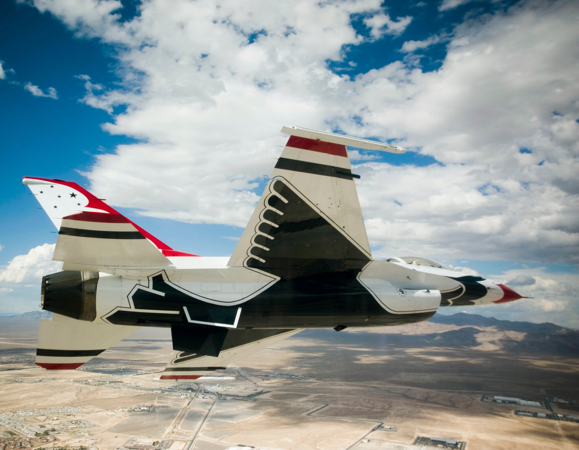 Thunderbird 4 piloted by Maj. Sean Gustafson prepares to land Oct. 4, 2010, at Nellis Air Force Base, Nev.  The Air Force Demonstration Squadron Thunderbirds were finishing a practice show at nearby Creech AFB. (U.S. Air Force photo/Staff Sgt. Larry E. Reid Jr.)
