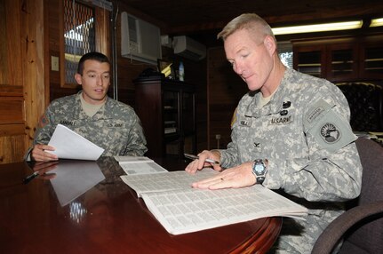 SOTO CANO AIR BASE, Honduras --  As the Joint Task Force-Bravo Combined Federal Campaign officer, 2nd Lt. Joshua Randall assists Col. Gregory Reilly, the JTF-Bravo commander, in making a donation to the charity campaign. Pledges made by Federal civilian, postal and military donors during the campaign season (September 1st to December 15th) support eligible non-profit organizations that provide health and human service benefits throughout the world. (U.S. Air Force photo/Tech. Sgt. Benjamin Rojek)