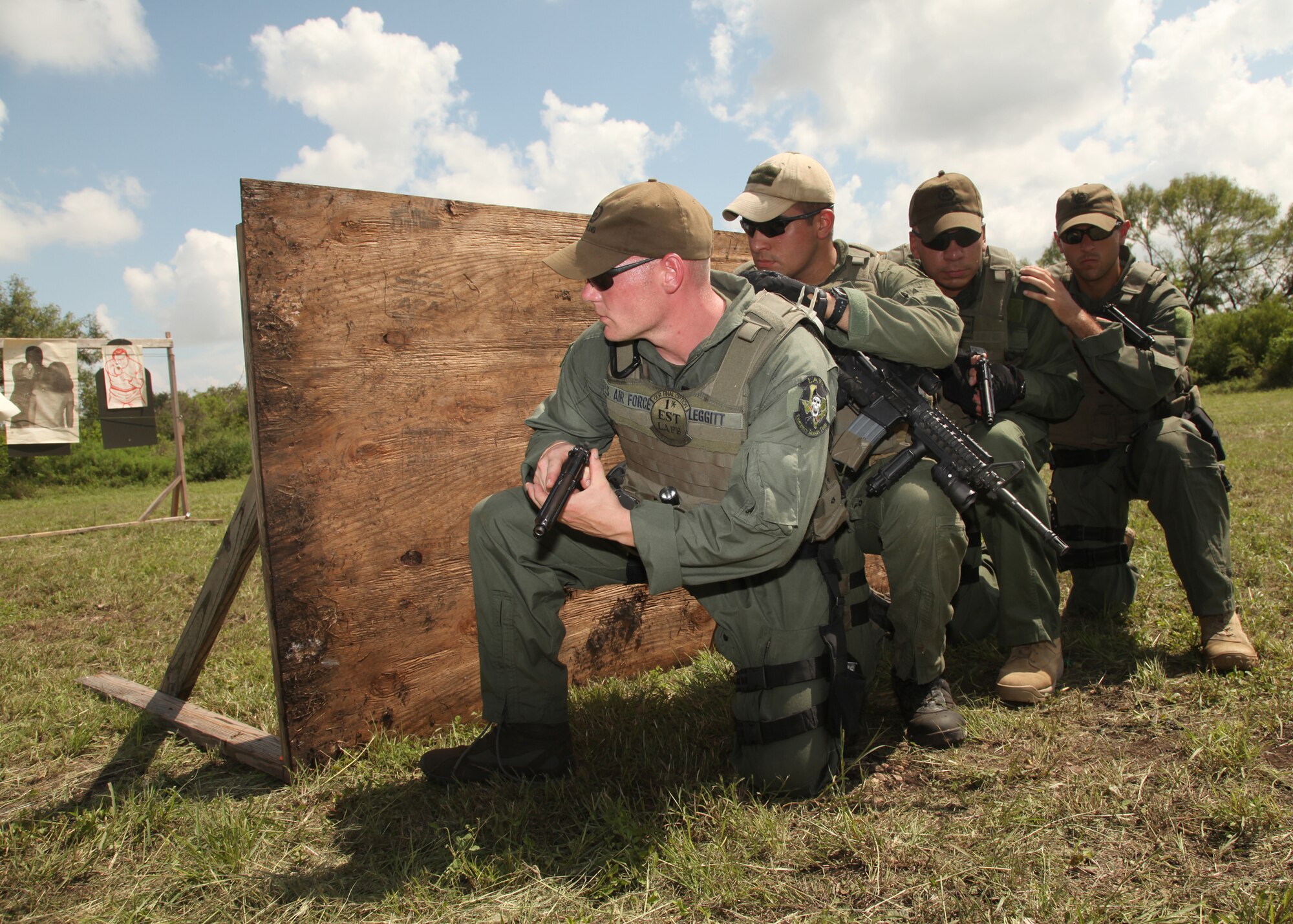 Airmen try out for the Lackland Emergency Services Team Sept. 25. The two-day tryout included a 1-mile run in a gas mask, a six-mile run in full gear, written tests and weapon qualification. (U.S. Air Force photo/Robbin Cresswell)