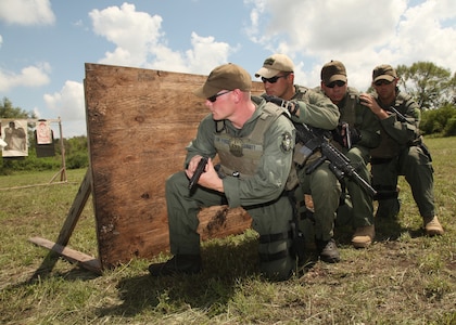 Airmen try out for the Lackland Emergency Services Team Sept. 25. The two-day tryout included a 1-mile run in a gas mask, a six-mile run in full gear, written tests and weapon qualification. (U.S. Air Force photo/Robbin Cresswell)