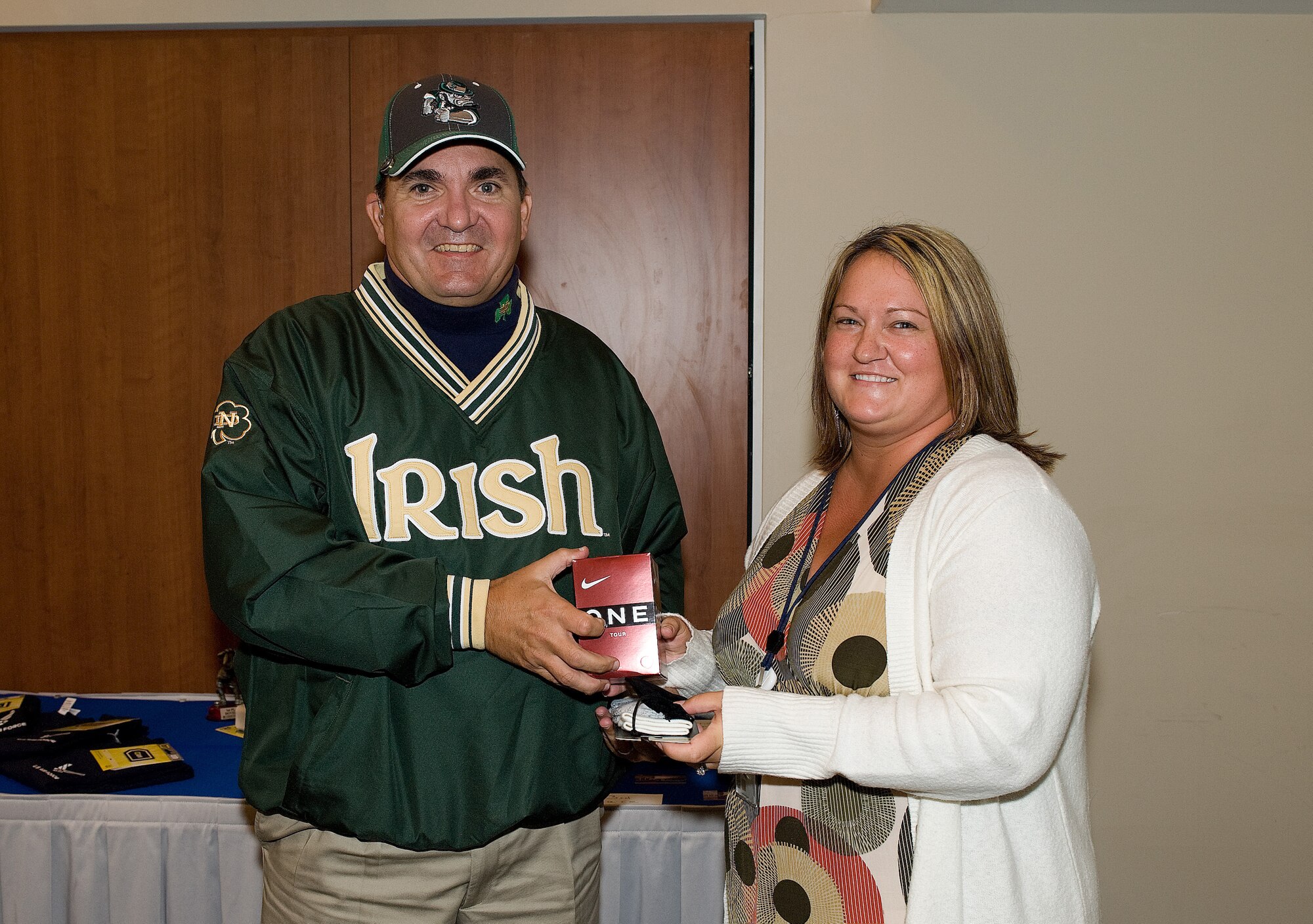 Master Sgt. Danny Gilseth, 512th Logistics Readiness Flight, receives a prize from Jennifer Vallee, 436th Airlift Wing chief of community relations, for scoring the longest drive during the Bluesuiters' Golf Tournament Oct. 6 at the Eagle Creek Golf Course. Sergeant Gilseth was also a member of the team that placed second in the tournament. 