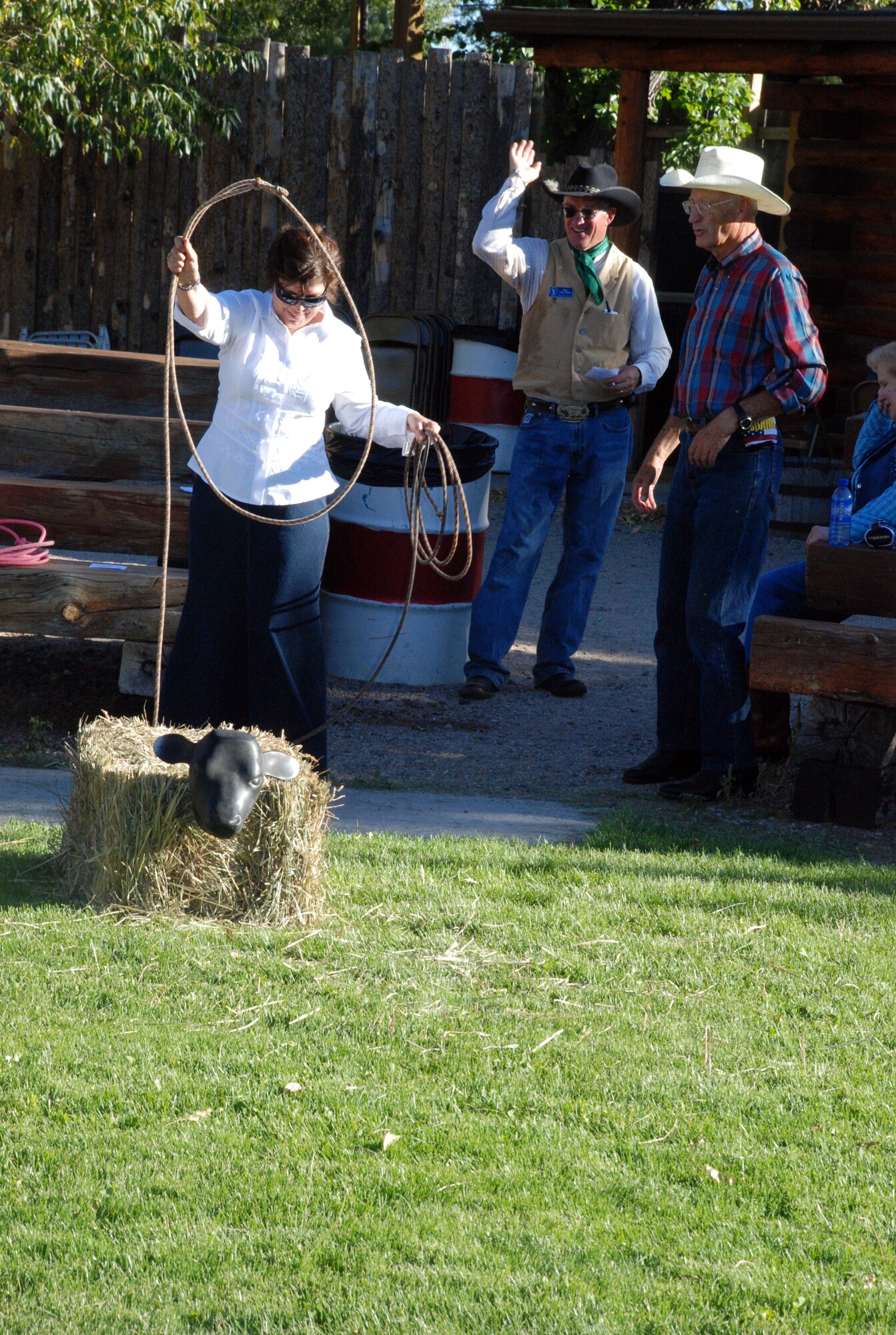 Lt. Col. Joanne Ruggeri, 90th Medical Operations Squadron commander, learns how to rope from civic leaders at the Honorary Commander’s Chuckwagon Dinner event, Sept. 26 at Frontier Park. (U.S. Air Force photo by 1st Lt. Brooke Brzozowske)