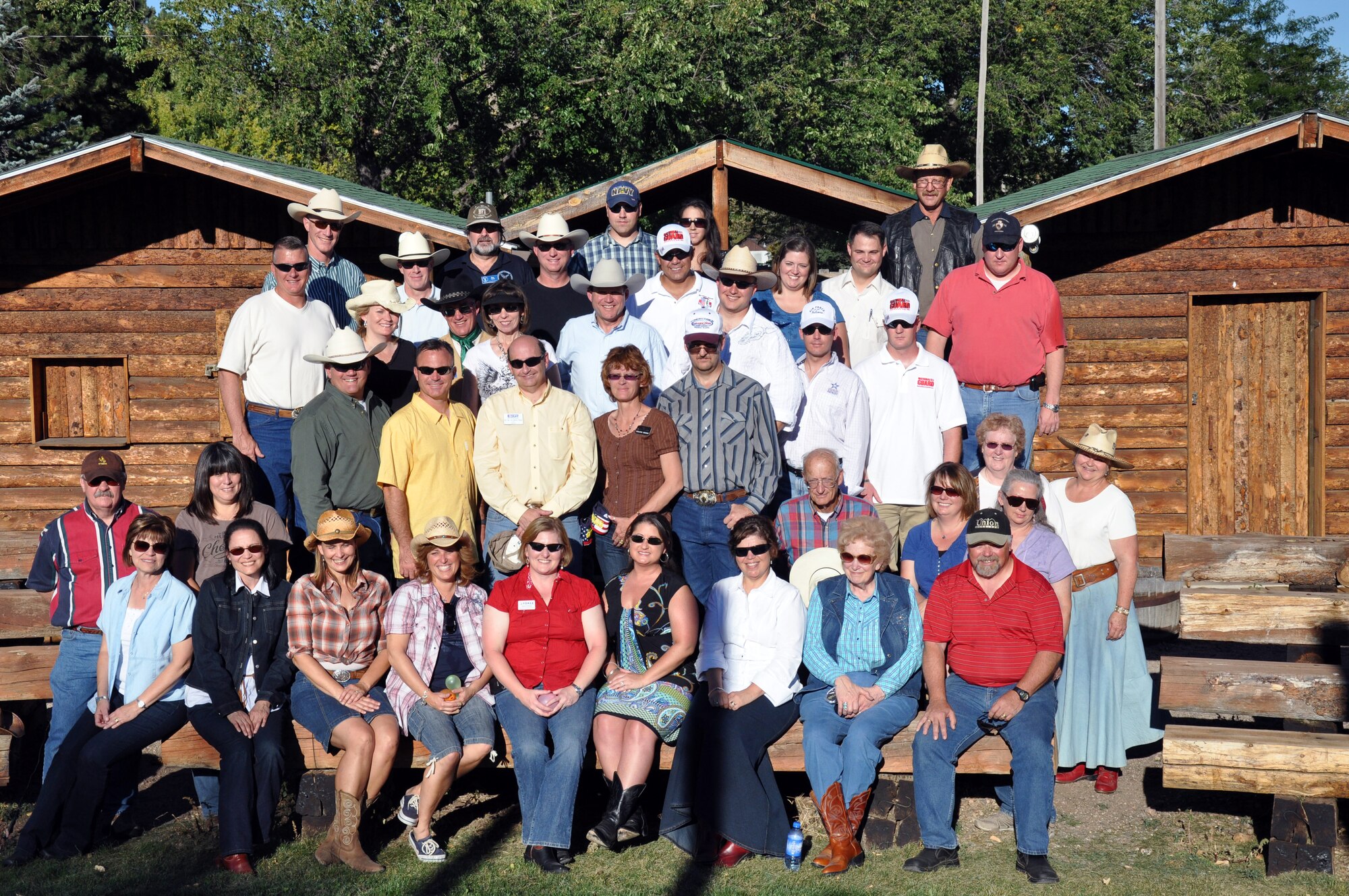 Attending military and civic leaders pose for a photo at the Honorary Commander’s Chuckwagon Dinner event, Sept. 26 at Frontier Park.  The Chuck Wagon Dinner event was hosted by civic leaders for Honorary Commanders, MAC members, prospective MAC members, as well as other community members who are interested in supporting the military. (U.S. Air Force photo by 1st Lt. Brooke Brzozowske)