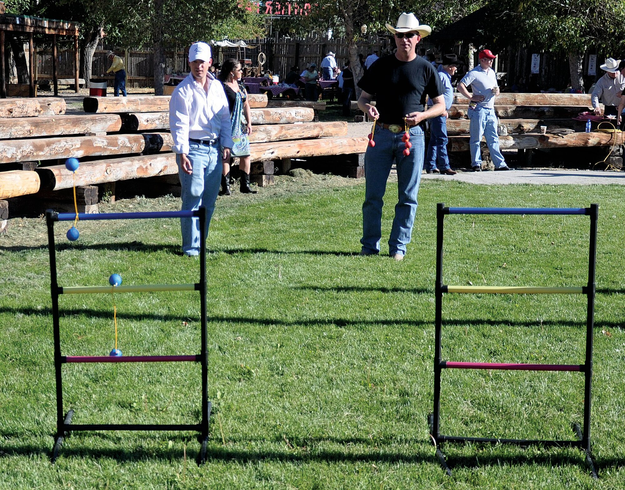 Lt. Col. Kiley Stinson, 90th Security Forces Group deputy commander, and Col. Scott Fox, 90th Missile Wing vice commander, play a game of tether golf at the Honorary Commander’s Chuckwagon Dinner event, Sept. 26 at Frontier Park.  The Chuck Wagon Dinner event was hosted by civic leaders for Honorary Commanders, MAC members, prospective MAC members, as well as other community members who are interested in supporting the military. (U.S. Air Force photo by 1st Lt. Brooke Brzozowske)