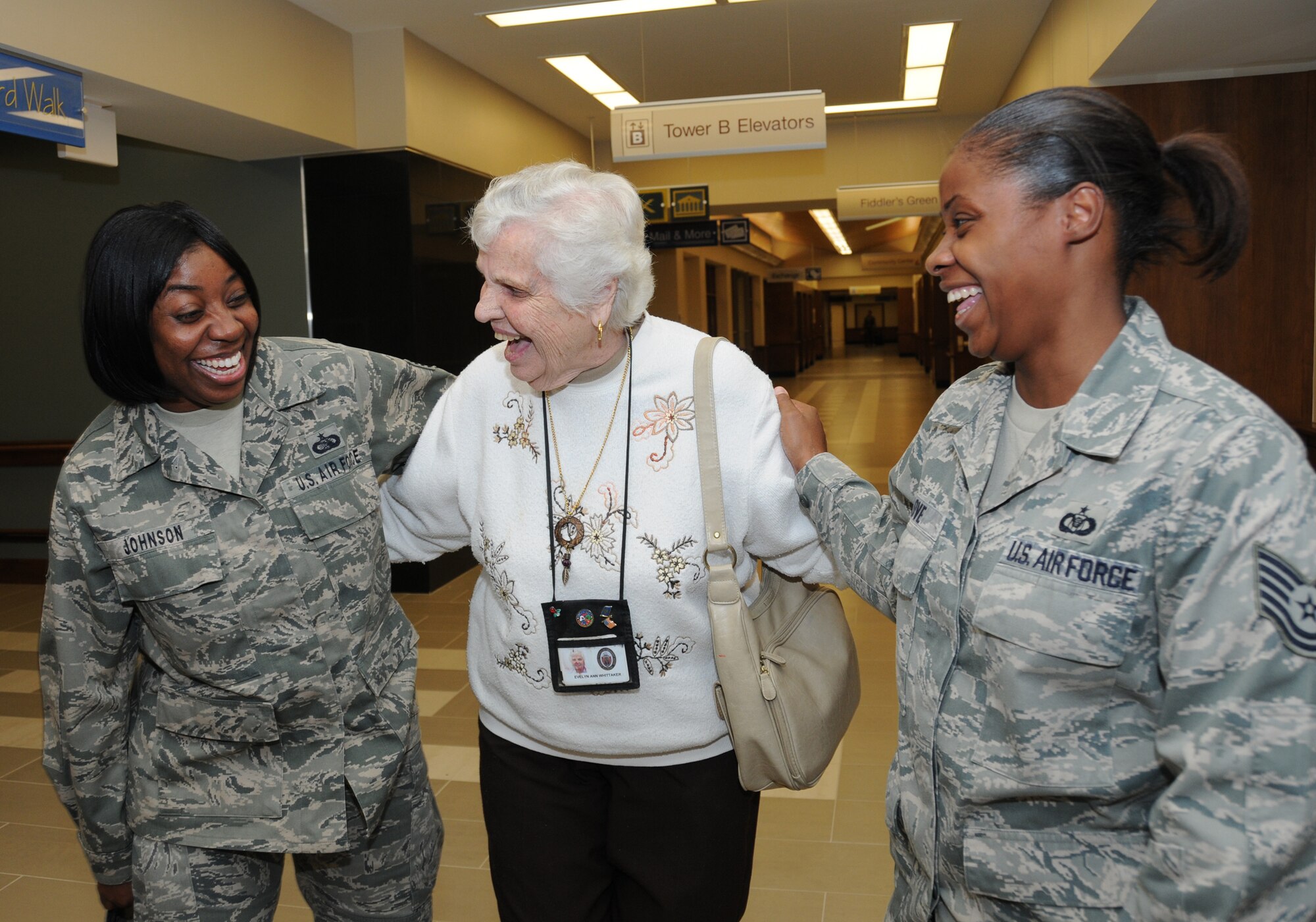 Staff Sgt. Reneé Johnson, left, 81st Training Support Squadron, and Tech. Sgt. Betty Love, right, 334th Training Squadron, welcome World War II veteran Evelynn Whittaker to her new home Monday.  (U.S. Air Force photo by Kemberly Groue)