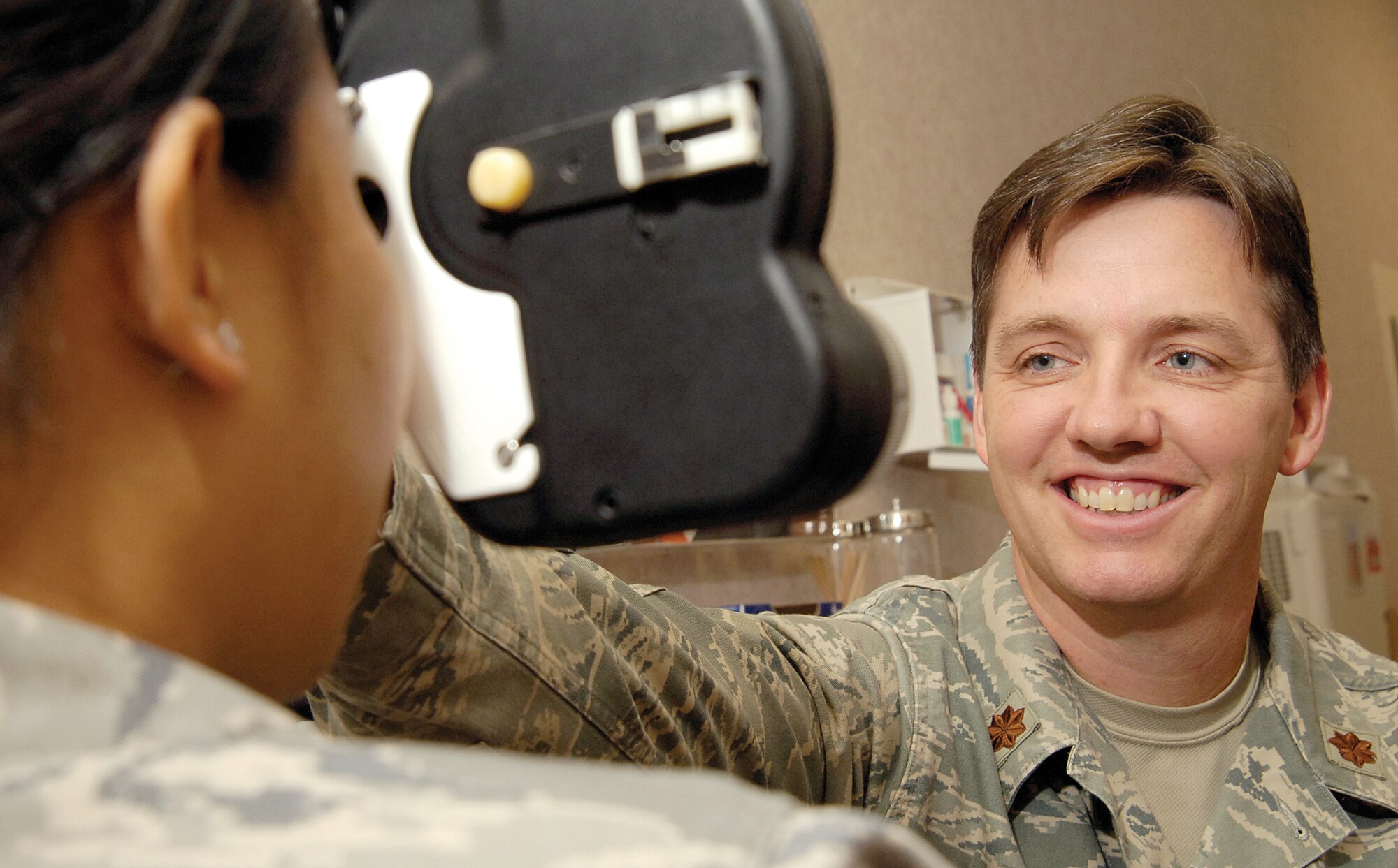 Optometrist Dr. (Maj.) Neil Horner is a native Oklahoman and returned to his home state and Tinker in June. A phoropter is a regular tool of his trade that helps him find proper correcting lenses for his patients in the 72nd Medical Group’s Optometry Clinic. (Air Force photo by Margo Wright)