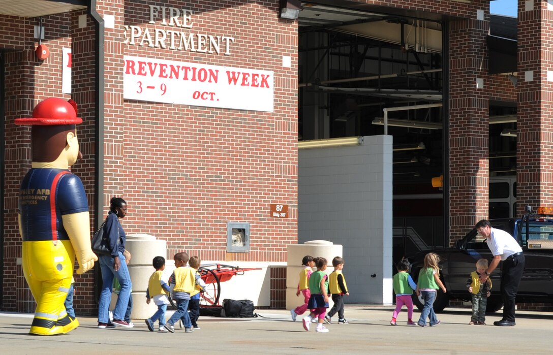 LANGLEY AIR FORCE BASE, Va. – Children from the National Security Agency Child Development Center, visit Langley Fire Department Oct. 7. Base firefighters are teaching children about fire safety during Fire Prevention Week, Oct. 3-9.  Events and activities promoting fire safety and prevention end this weekend with Saturday’s fire department open house. (U.S. Air Force photo/Staff Sgt. Tabitha Kuykendall) (released)