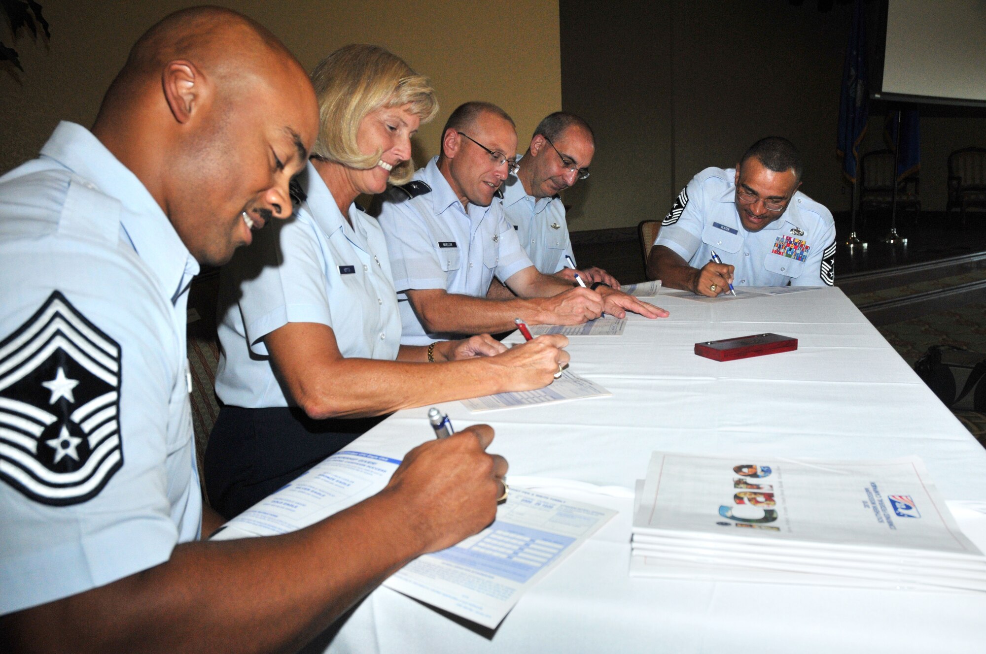 From left, Chief Master Sgt. Linus Jordan, command chief, and Maj. Gen. Mary Kay
Hertog, commander, 2nd Air Force; Brig. Gen. Andrew Mueller, 81st Training Wing commander;  Brig. Gen. James Muscatell Jr., 403rd Wing commander; and Chief Master Sgt. Lonnie Slater, 81st TRW command chief, sign their pledge forms for the 2010 Combined Federal Campaign at a kickoff ceremony Monday. The goal for this year’s campaign, which runs through Nov. 3, is $135,542, according to Capt. Kara Wisniewski, 81st Medical Operations Group, project officer.  (U.S. Air Force photo by Adam Bond)