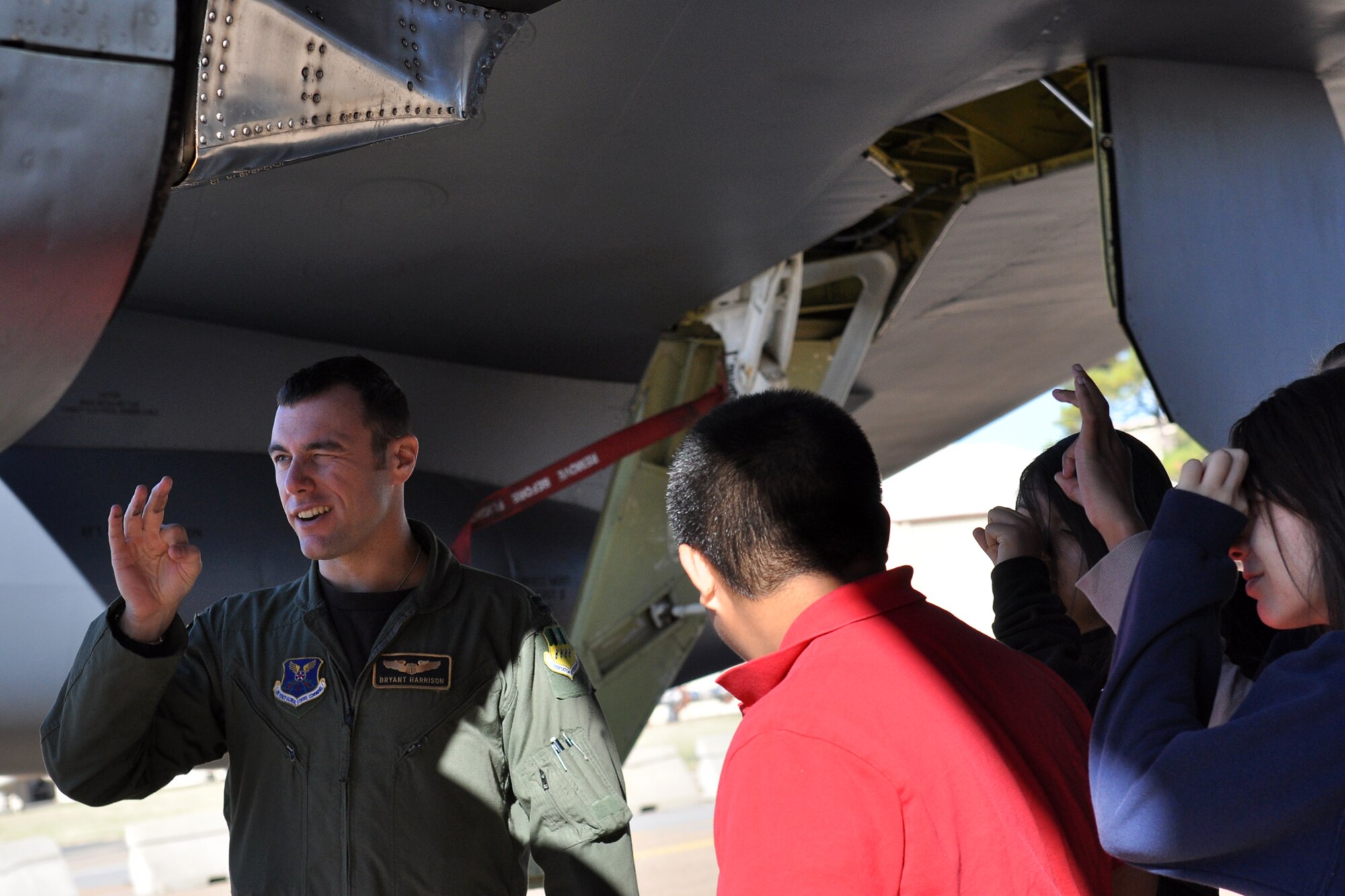 Capt. Bryant Harrison, 11th Bomb Squadron, demonstrates the “binocular effect” used to inspecting engines for damage to a group of 8th Grade students from Haughton Middle School Aerial Space Class during a briefing on the B-52 Stratofortress at Barksdale Air Force Base, La., Oct. 4, 2010. Captain Harrison is currently a student at the 93rd Bomb Squadron’s Formal Training Unit. The students were at Barksdale for a tour of the 917th Wing. In addition to the briefing at the B-52, the tour included stops at the engine shop, life support, an A-10 Thunderbolt II briefing, and lunch at the Red River Dining Facility. (U.S. Air Force photo/Betty Stephens) 