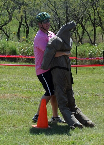 ABILENE, Texas-- Craig Martin, an Abilene firefighter, drags a 180 pound dummy during the 3rd annual Gun-N-Hoses Competition at the Warren Dodson Training Facility here, Oct. 2. The competition is a way for Dyess Airmen to interact with the Abilene community. Abilene firefighters, police officers and Dyess’ security forces competed against one another in a friendly competition of skills that included a hose pull, dummy drag and pistol shooting. (U.S. Air Force photo/ Senior Airman Felicia Juenke)