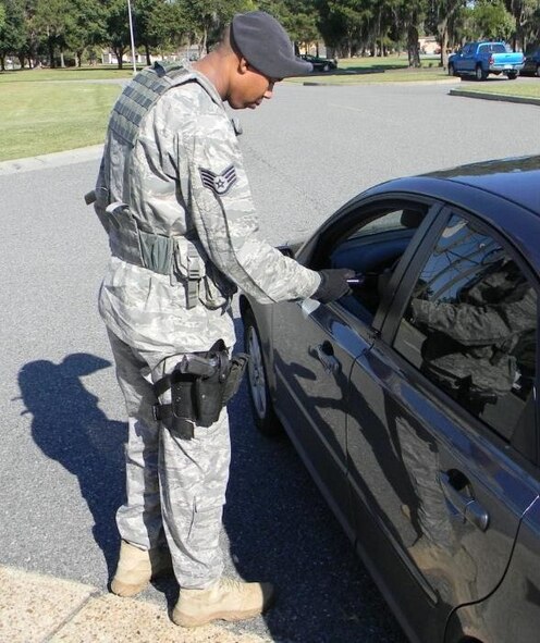 MOODY AIR FORCE BASE, Ga. -- Staff Sgt. Dustin Drake, 23rd Security Forces Squadron patrolman, practices using an alcohol sensing wand here during training Oct. 6. The wand can detect the amount of alcohol on an individual’s breath from about a foot away. This is part of an initiative to prevent individuals from driving and driving, as well as from leaving base and becoming a threat to the local community. 