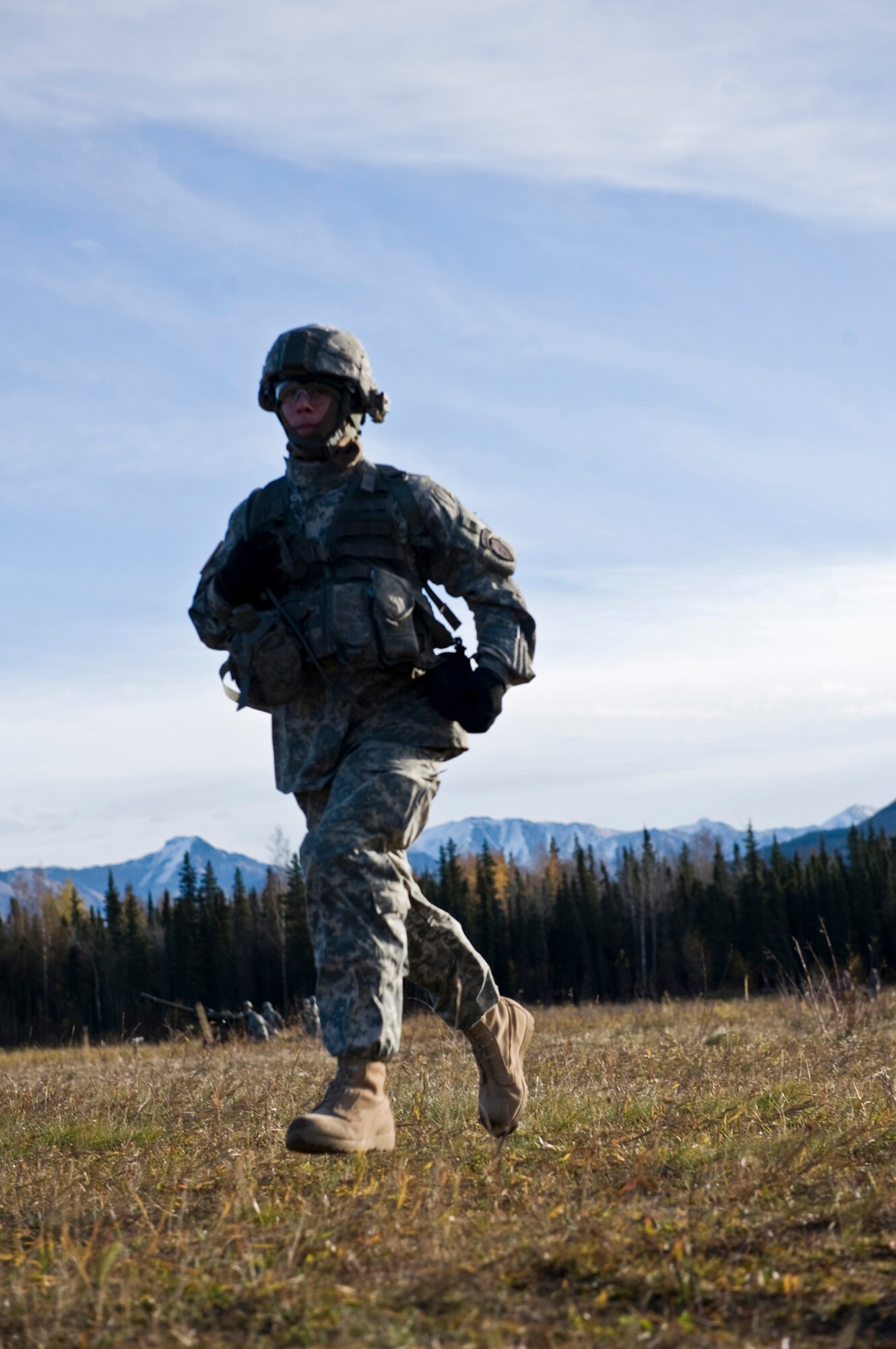 JOINT BASE ELMENDORF-RICHARDSON, Alaska -- Spc. Timmie Powers runs back to his section during a training session Oct. 5. Spc. Powers is with the 1st Section of the Alpha Battery from the 2nd Battalion of the 377th Parachute Field Artillery Regiment. Members of the 2-377th PFAR simulated a two-gun raid, firing into "enemy territory," as part of some mission-ready training. They used M119 105 mm howitzers which were sling loaded to the Black Hawk as part of the training. (U.S. Air Force photo/Airman 1st Class Christopher Gross)  