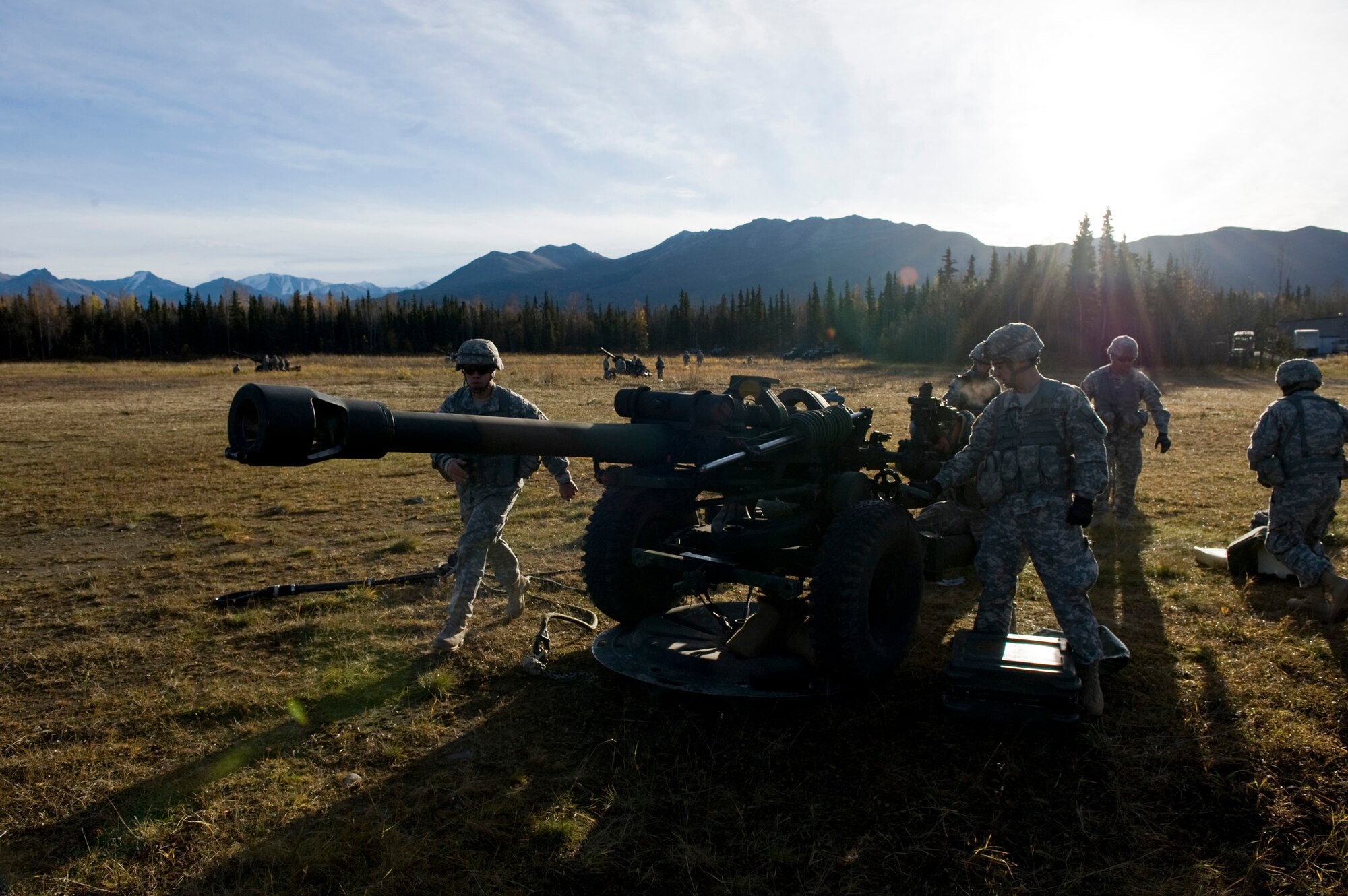 JOINT BASE ELMENDORF-RICHARDSON, Alaska -- Soldiers from the 1st Section of the Alpha Battery from the 2nd Battalion of the 377th Parachute Field Artillery Regiment set up their 105 mm howitzer Oct. 5. Members of the 2-377th PFAR simulated a two-gun raid, firing into "enemy territory," as part of some mission-ready training. They used an M119 105 mm howitzers which were sling loaded to the Black Hawk as part of the training. (U.S. Air Force photo/Airman 1st Class Christopher Gross)  