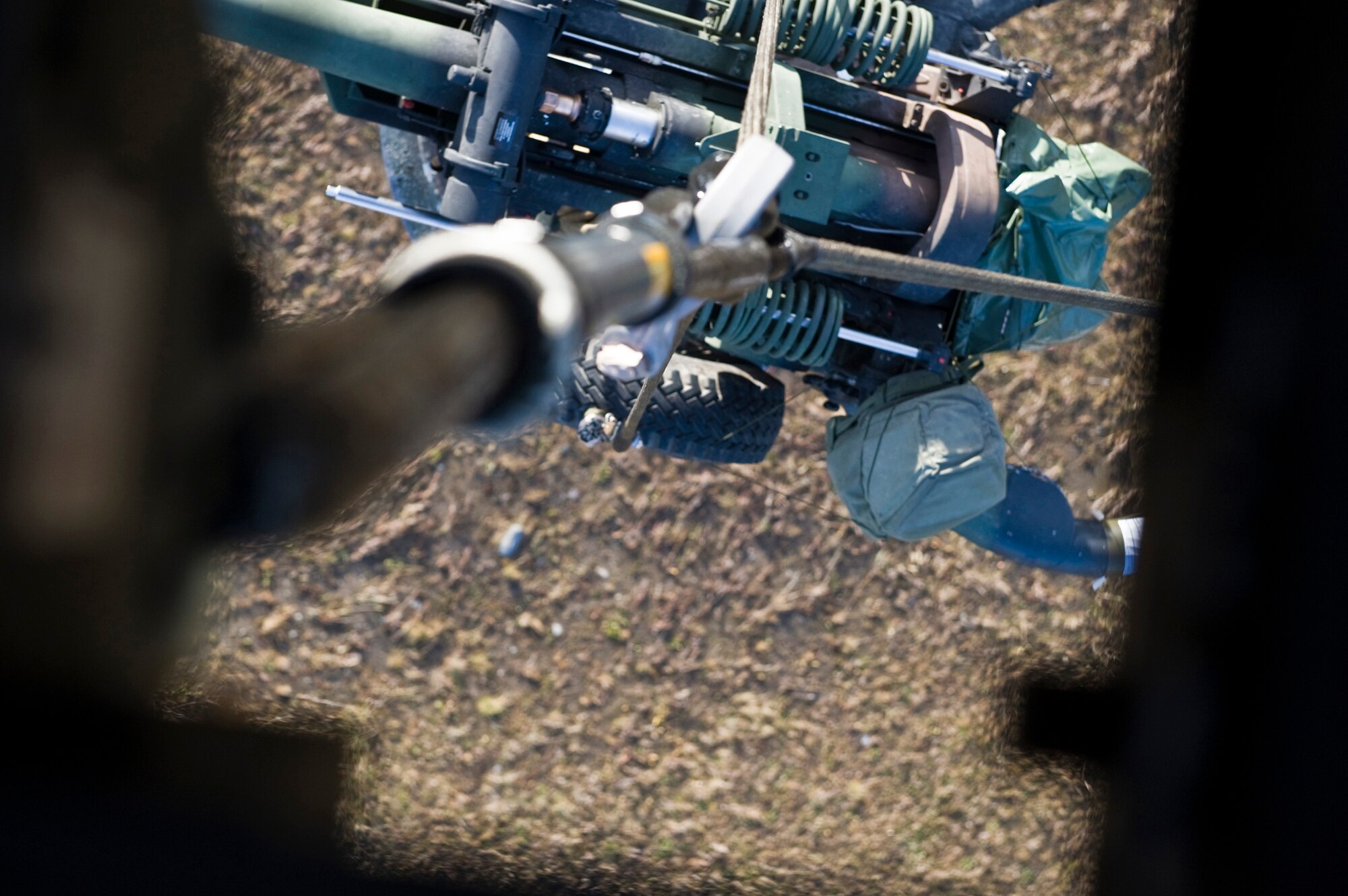 JOINT BASE ELMENDORF-RICHARDSON, Alaska -- An M119 105 mm howitzer is being lifted by an Army UH-60 Black Hawk during a training mission Oct. 5. A Battery from the 2nd Battalion of the 377th Parachute Field Artillery Regiment simulated a two-gun raid, firing into "enemy territory," as part of some mission-ready training. (U.S. Air Force photo/Airman 1st Class Christopher Gross)  