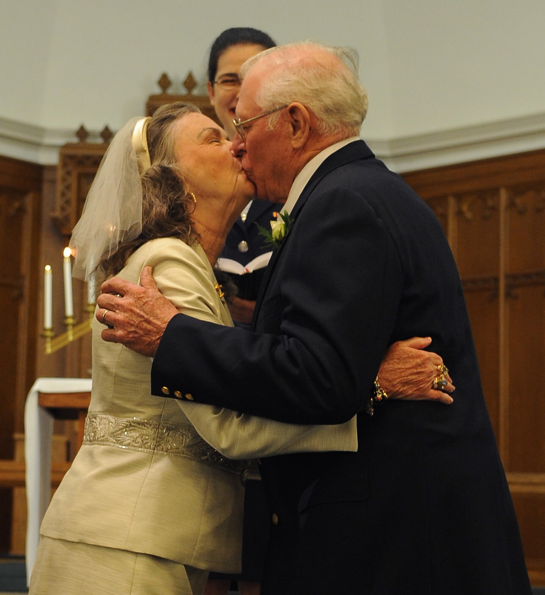 BARKSDALE AIR FORCE BASE, La. -- Nancy and Kenneth Scott share a kiss at their vow renewal ceremony 51 years after their wedding, Oct. 2. Kenneth and Nancy drove from Florida to Barksdale to celebrate their wedding anniversary at the very same chapel they were married in 51 years ago. (U.S. Air Force photo/Senior Airman Amber Ashcraft) (RELEASED)