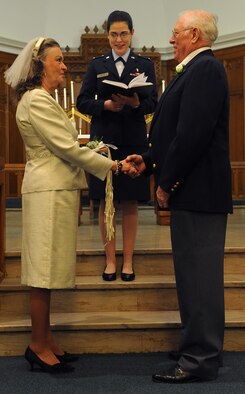 BARKSDALE AIR FORCE BASE, La. -- Kenneth Scott, a retired Air Force Senior Master Sgt., repeats his vows to wife, Nancy, during a vow renewal ceremony here Oct. 2. Kenneth and Nancy drove from Florida to Barksdale to celebrate their wedding anniversary at the very same chapel they were married in 51 years ago. (U.S. Air Force photo/Senior Airman Amber Ashcraft) (RELEASED)