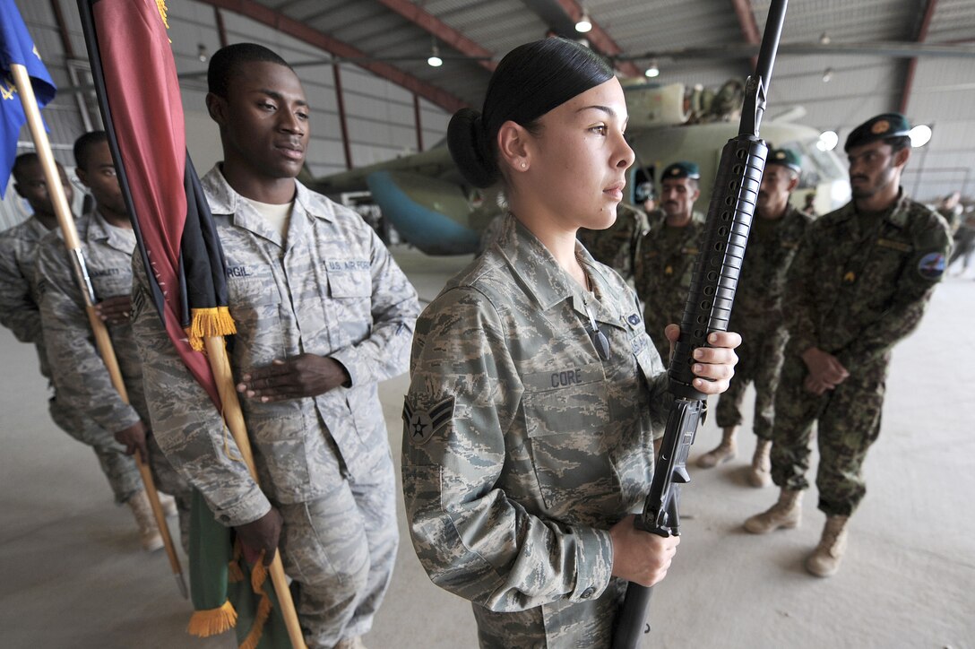 Members of the 451st Air Expeditionary Wing Honor Guard demonstrate how to post colors Oct. 3, 2010, at Kandahar Airfield, Afghanistan. The 451st AEW Honor Guard members worked with the Afghans to help them prepare their own Honor Guard for a ceremony marking the one year anniversary of the Kandahar Air Wing. (U.S. Air Force photo/Tech. Sgt. Chad Chisholm)