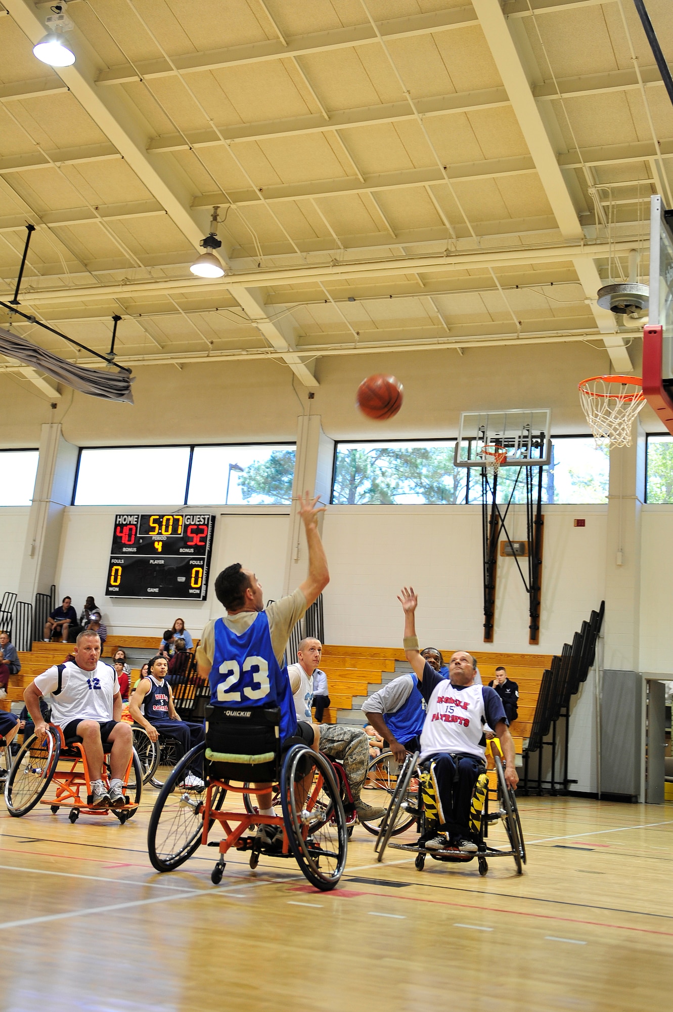 U.S. Air Force Staff Sgt. Trebor Boynton, Air Force Combat Weather Center, shoots the ball during the fifth annual Wheelchair Basketball Exhibition Game at the Aderholt Fitness Center at Hurlburt Field, Fla., Oct. 4, 2010. The Air Commandos hosted the Mobile Patriots, a Gulf Coast division three National Wheelchair Basketball Association team, in recognition of National Disability Employment Awareness month. (DoD photo by U.S. Air Force Staff Sgt. Stephanie Jacobs/RELEASED)


