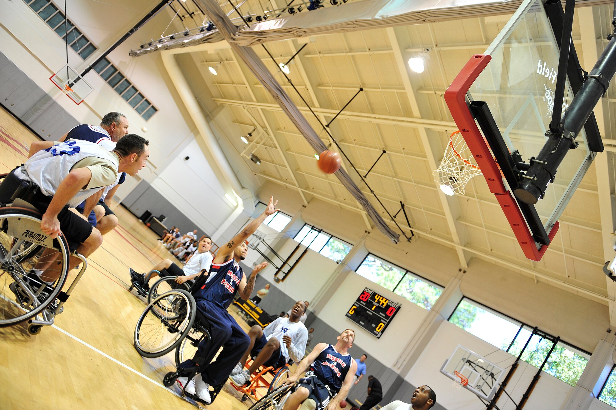 Kenny Lee, a Mobile Patriots player, shoots the ball during a match against the Air Commandos during the fifth annual Wheelchair Basketball Exhibition Game at the Aderholt Fitness Center at Hurlburt Field, Fla., Oct. 4, 2010. The Air Commandos hosted the Mobile Patriots, a Gulf Coast division three National Wheelchair Basketball Association team, in recognition of National Disability Employment Awareness month. (DoD photo by U.S. Air Force Staff Sgt. Stephanie Jacobs/RELEASED)

