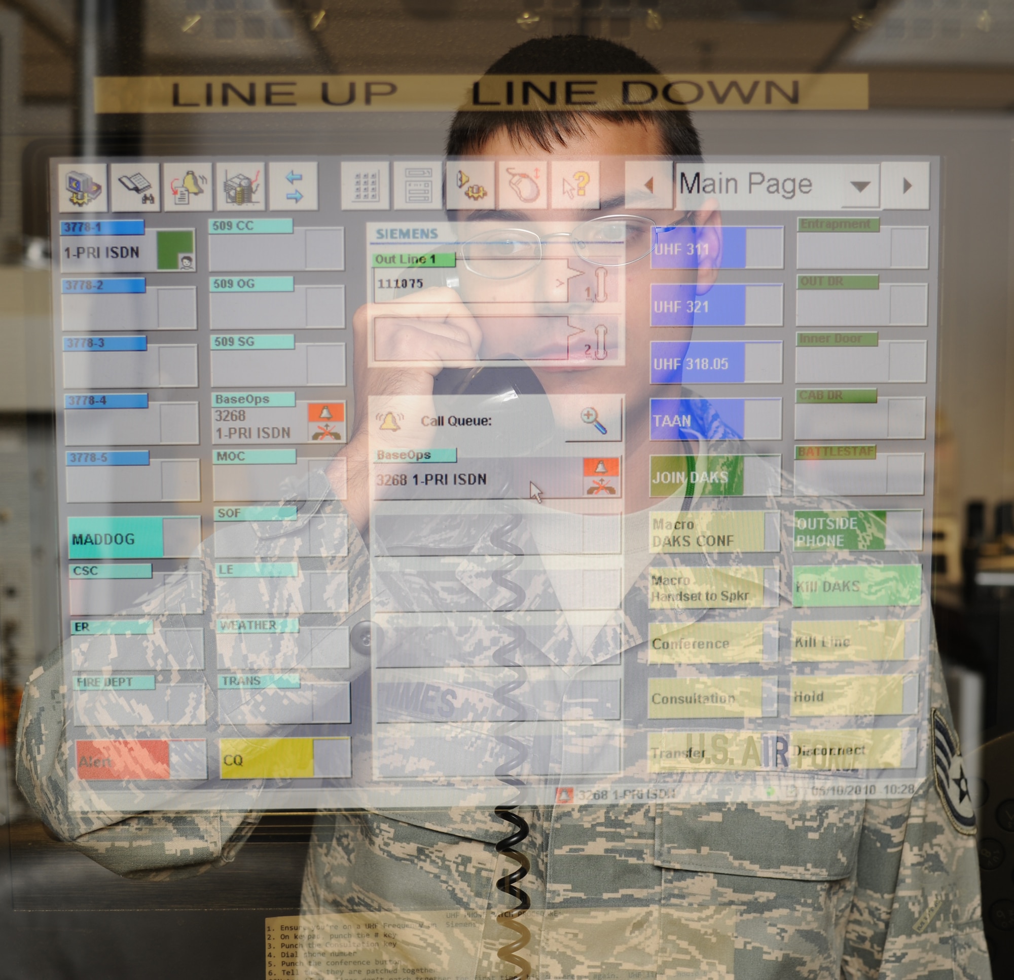 WHITEMAN AIR FORCE BASE, Mo. - Staff Sgt. Nicholas Himes, 509th Bomb Wing Command Post senior emergency action controller, receives a call from base operations on an aircrafts status, Oct. 5. Whiteman's Command Post receives more than 100 calls a day ranging from emergency response or real time events happening around the world. (U.S. Air Force photo by Senior Airman Carlin Leslie)