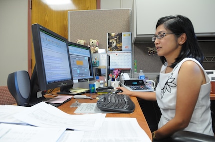 Randolph AFB, TX, 7 Oct 10: Shirley Lozares, non appropriated funds analyst, works in her new office in the newly opened finance center.
(U.S. Air Force photo/Amn Alexis Siekert)