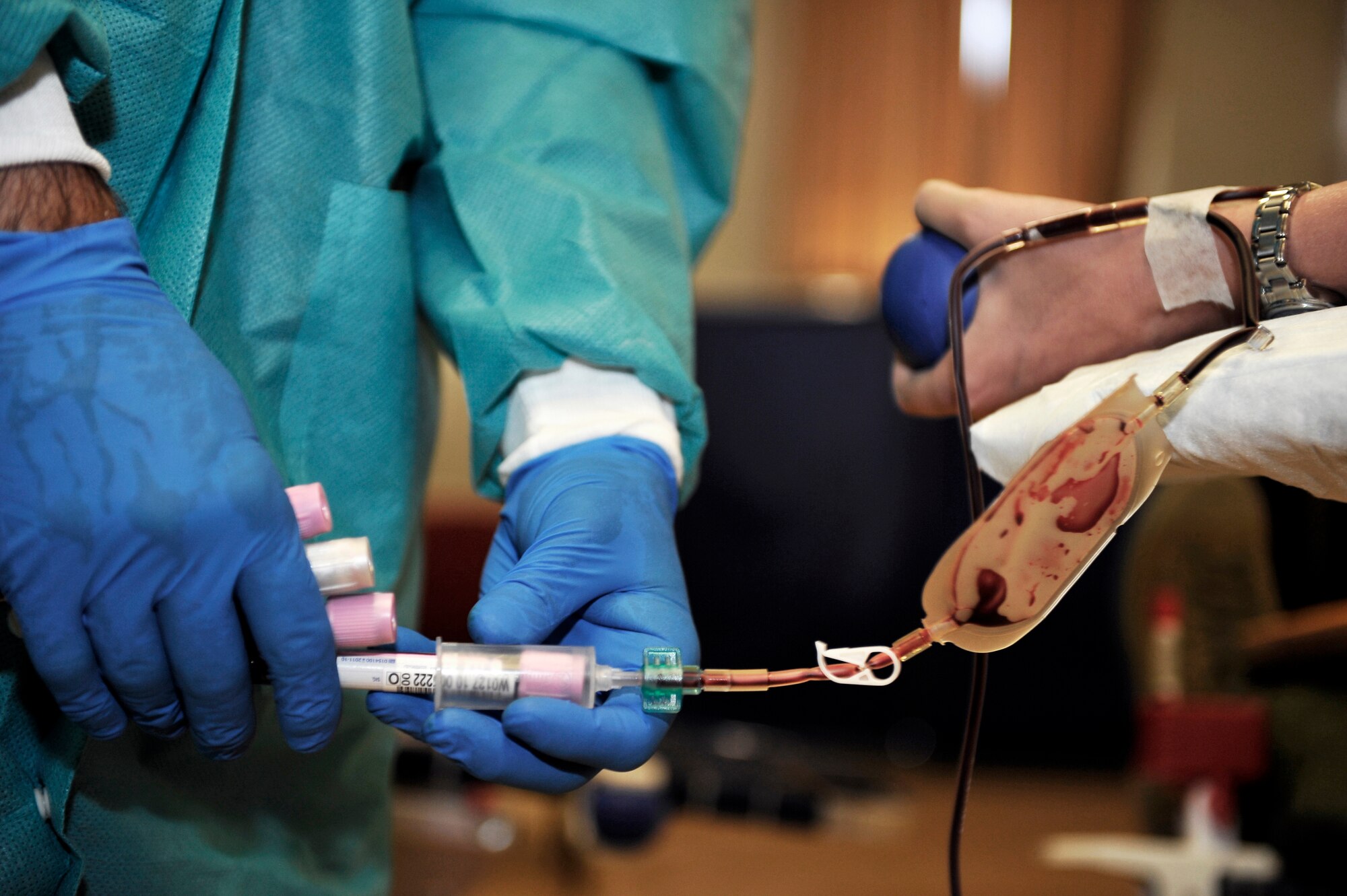 HOLLOMAN AIR FORCE BASE, N.M. -- Sgt. Victor Vazquez-Mejias, a phlebotomist from the Blood Donor Center at William Beaumont Army Medical Center in El Paso, Texas, draws blood from Senior Airman Jennifer Zietkiewicz, 6th Reconnaissance Squadron, during the Armed Services Blood Drive Oct. 4, 2010. Sgt. Vazquez-Mejias visited Holloman to get blood donations that will go directly to the overseas war fighters and military treatment facilities in the U.S. and abroad. (U.S. Air Force photo by Senior Airman Veronica Stamps / Released)
