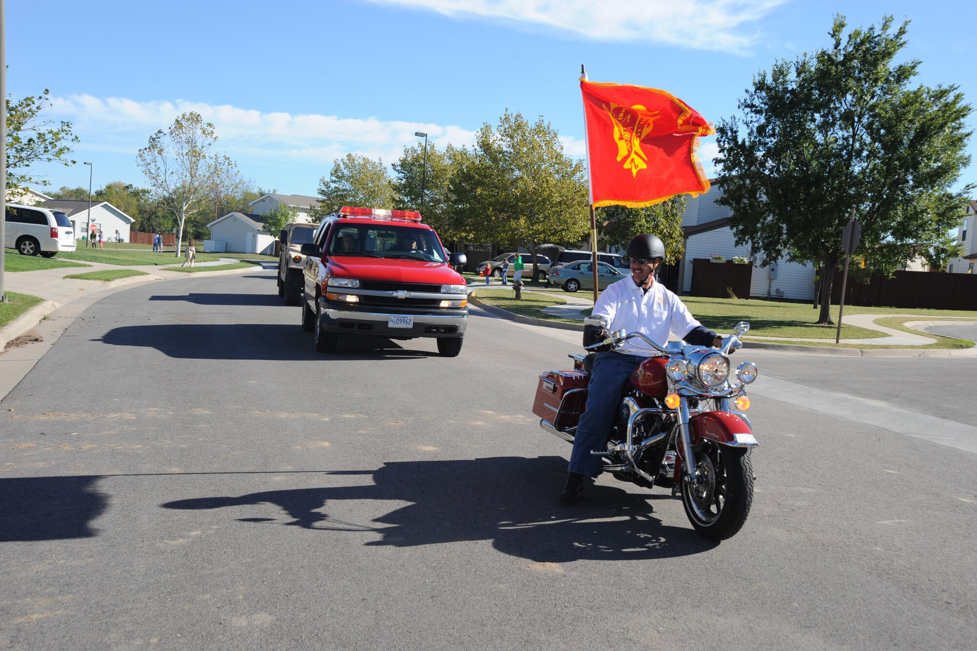 Master Sgt. Joseph Forro, 22nd Civil Engineer Squadron acting deputy fire chief, leads a parade to kick off Fire Prevention Week, Oct. 2, 2010, McConnell Air Force Base, Kan.  The fire department hosted the sixth annual Fire Prevention Extravaganza at McConnell family housing which included a parade, games, safety displays and a rescue response demonstration.  “Smoke Alarms: A Sound You Can Live With!” is this year’s theme for the nationwide Fire Prevention Week campaign, which runs from Oct. 3 through 9.   (U.S. Air Force photo/Staff Sgt. Dallas Edwards)