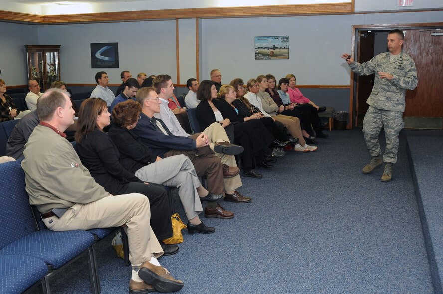 Lt. Col. Darin Driggers, 319th Operations Support Squadron commander, briefs the Grand Forks Chamber of Commerce leadership tour participants on effective middle management leadership skills Oct. 6 at Grand Forks Air Force Base. The Grand Forks Chamber hosts a yearly leadership class for rising leaders within the community to educate them on various aspects of leadership. The base tour showcased different types of military leadership and training such as the Airman Leadership School and the first term airman center. (U.S. Air Force photo by Tech. Sgt. Johnny Saldivar)