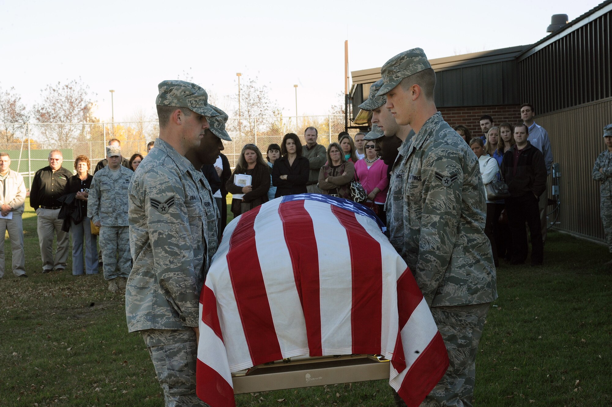 Airmen from Grand Forks Air Force Base Honor Guard demonstrate a retiree funeral sequence for the Grand Forks Chamber of Commerce leadership tour Oct. 6 at Grand Forks AFB. The Grand Forks Chamber hosts a yearly leadership class for rising leaders within the community to educate them on various aspects of leadership. The base tour showcased different types of military leadership and training such as the Airman Leadership School and the first term airman center. (U.S. Air Force photo by Tech. Sgt. Johnny Saldivar)