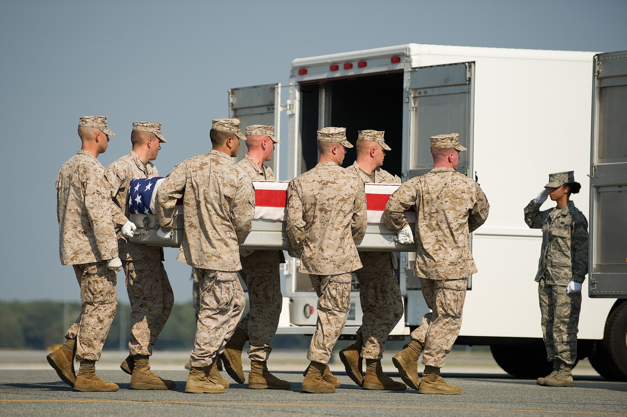 A U.S. Marine Corps carry team transfers the remains of Marine Pfc. Joshua S. Ose of Hernando, Miss., at Dover Air Force Base, Del., Sept 22, 2010.  He was assigned to 1st Battalion, 8th Marine Regiment, 2nd Marine Division, II Marine Expeditionary Force, Camp Lejeune, N.C. (U.S. Air Force photo/Roland Balik)
