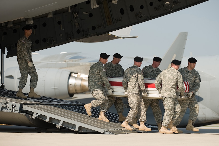 A U.S. Army carry team transfers the remains of Army Sgt. Marvin R. Calhoun Jr. of Elkhart, Ind., at Dover Air Force Base, Del., Sept 22, 2010.  He was assigned to 101st Combat Aviation Brigade, 101st Airborne Division (Air Assault), Fort Campbell, Ky. (U.S. Air Force photo/Roland Balik)