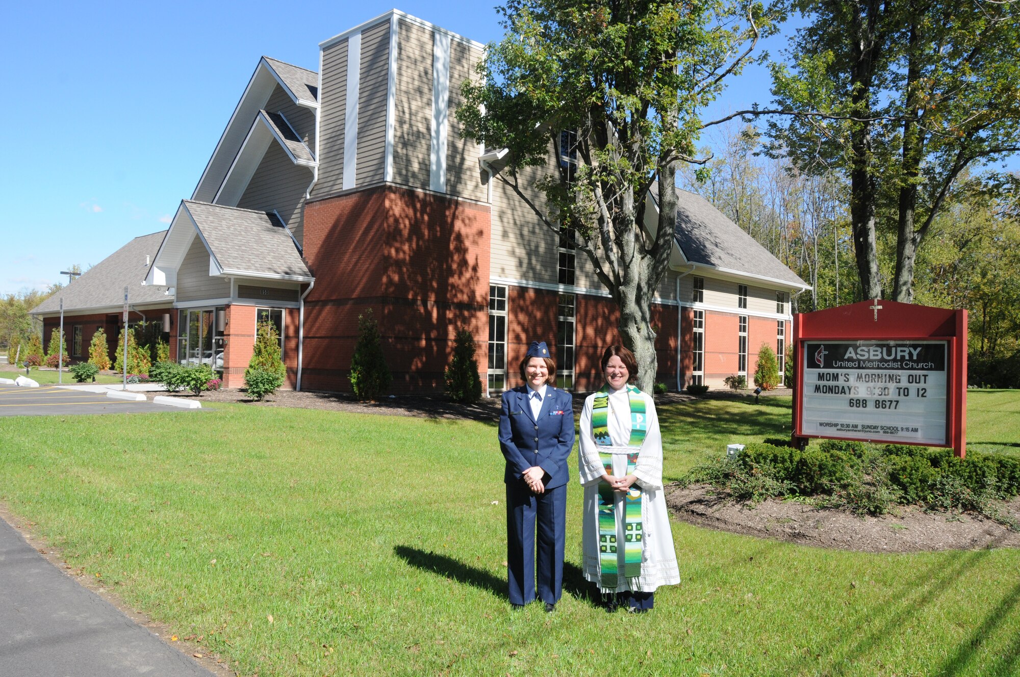 107th Chaplain (Maj.) Jackie Kraft on left and Pastor Jackie Kraft on right are one in the same. Although she wears two different uniforms the message is the same. Pastor Kraft along with her congregation recently relocated to their new church in Getzville. (U.S. Air Force illustration/Staff Sgt. Peter Dean) 