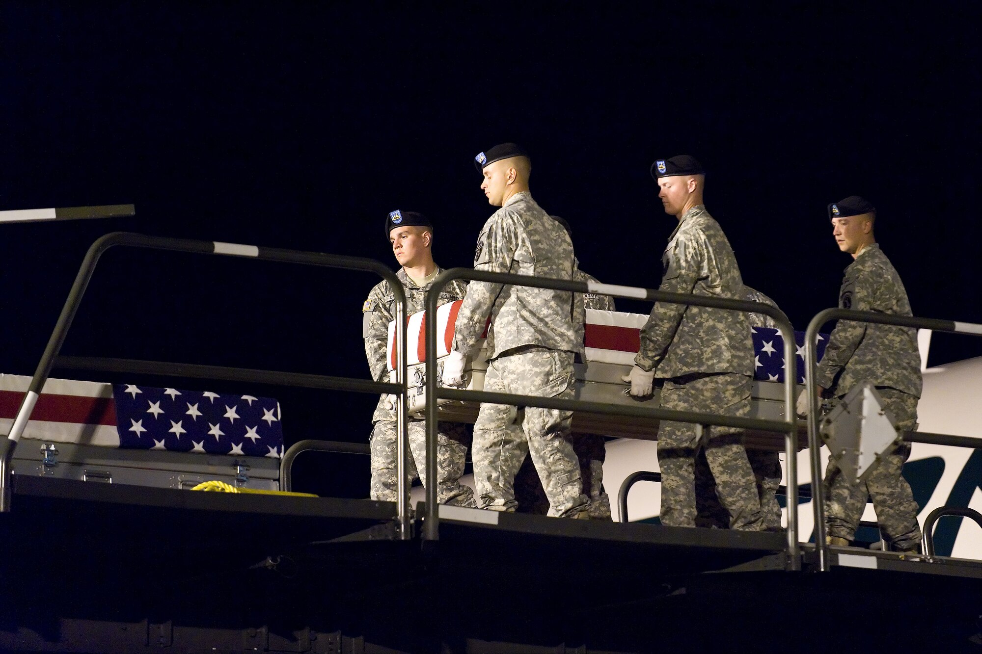 A U.S. Army carry team transfers the remains of Army Spc. Deangelo B. Snow, of Saginaw, Mich., at Dover Air Force Base, Del., Sept. 18, 2010. Snow was assigned to the 526th Brigade Support Battalion, 2nd Brigade Combat Team, 101st Airborne Division (Air Assault), Fort Campbell, Ky. (U.S. Air Force photo/Roland Balik)