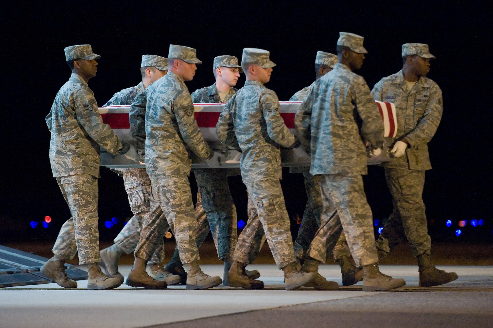A U.S. Air Force carry team transfers the remains of Air Force Senior Airman Daniel R. Sanchez, of El Paso, Texas, at Dover Air Force Base, Del., Sept. 18, 2010. Sanchez was assigned to the 23rd Special Tactics Squadron, Hurlburt Field, Fla. (U.S. Air Force photo/Roland Balik)
