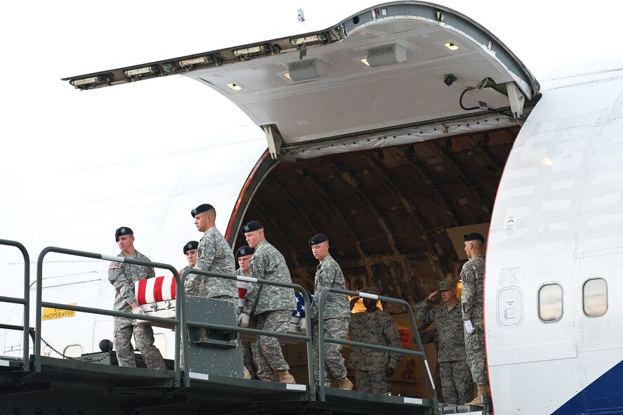 A U.S. Army carry team transfers the remains of Army Sgt. John F. Butler III, of Baltimore, Md., at Dover Air Force Base, Del., Sept. 17, 2010. Burner was assigned to the 63rd Signal Battalion (Expeditionary), 35th Signal Brigade, Fort Gordon, Ga. (U.S. Air Force photo/Roland Balik)