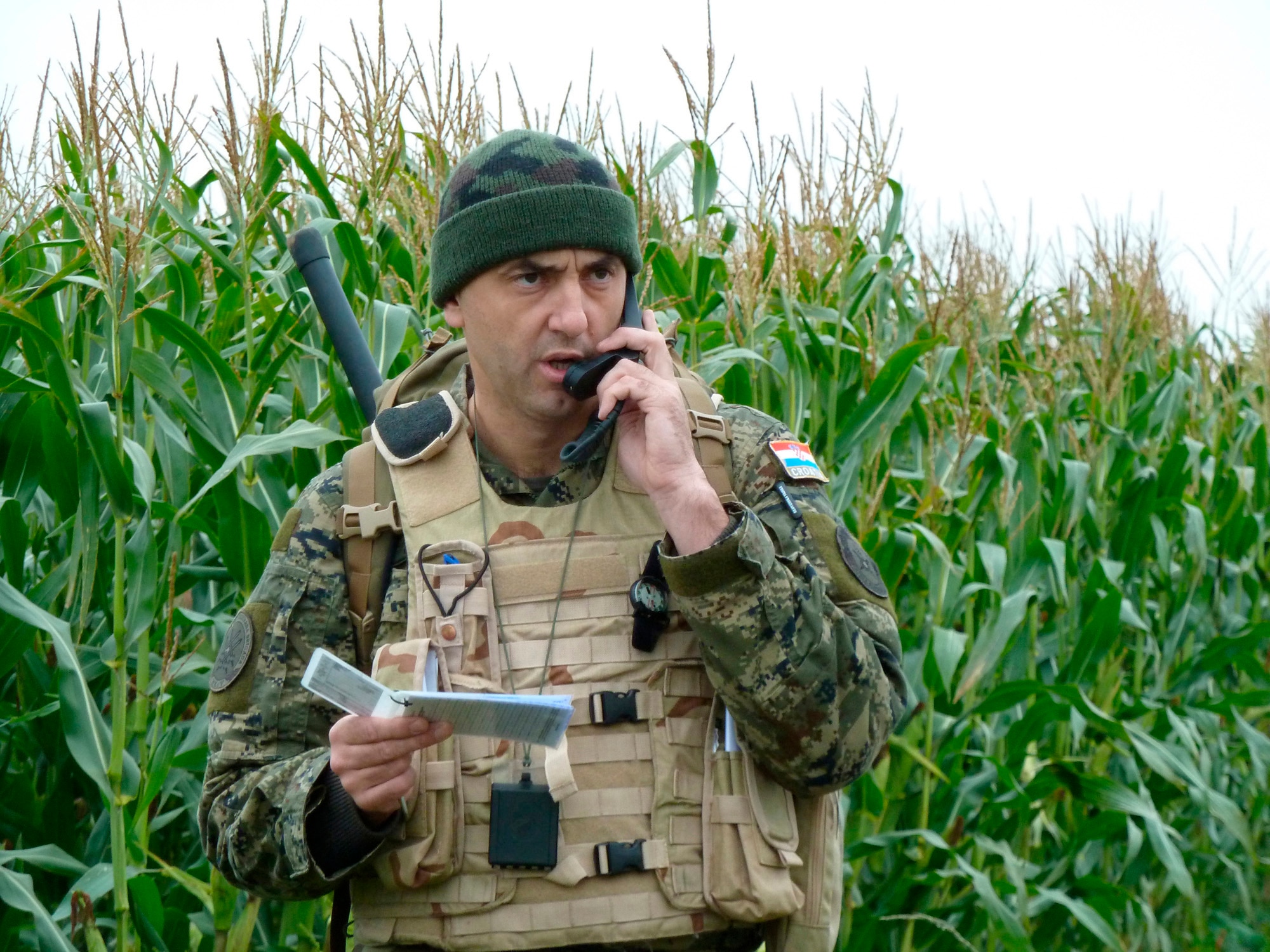 BANN, Germany -- Croatian army Sgt. Robert Alaugsic, a student at the U.S. Air Forces in Europe Air Ground Operations School, talks to an approaching aircraft during a field training exercise Sept. 28, 2010. The USAFE AGOS conducts a five-week initial training course for U.S. and NATO joint terminal attack controllers. The first class for fiscal 2011 is scheduled to graduate Oct. 8. (U.S. Air Force photo/Tech. Sgt. Francesca Popp)