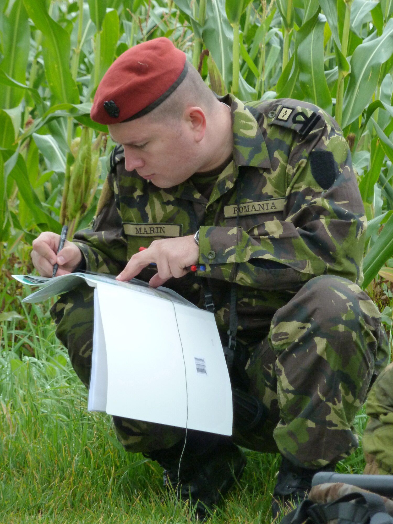BANN, Germany -- Romanian army 1st Lt. Daniel Marin, a student at the U.S. Air Forces in Europe Air Ground Operations School, maps a course during a field training exercise Sept. 28, 2010. The USAFE AGOS conducts a five-week initial training course for U.S. and NATO joint terminal attack controllers. The first class for fiscal 2011 is scheduled to graduate Oct. 8. (U.S. Air Force photo/Tech. Sgt. Francesca Popp)
