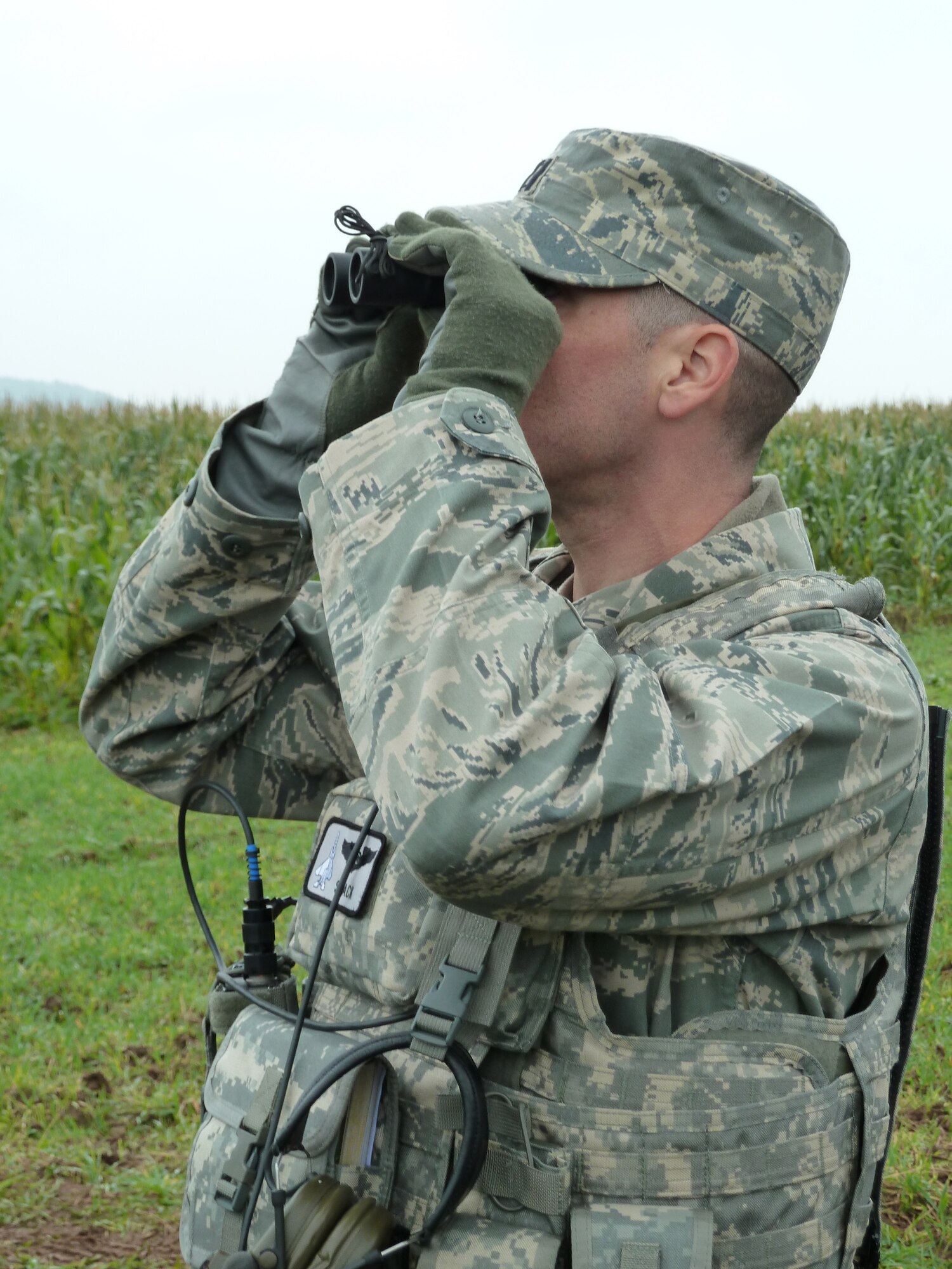 BANN, Germany -- Capt. Jon Chango, U.S. Air Forces in Europe Air Ground Operations School course director, looks for the target during a field training exercise Sept. 28, 2010. The USAFE AGOS conducts a five-week initial training course for U.S. and NATO joint terminal attack controllers. (U.S. Air Force photo/Tech. Sgt. Francesca Popp)