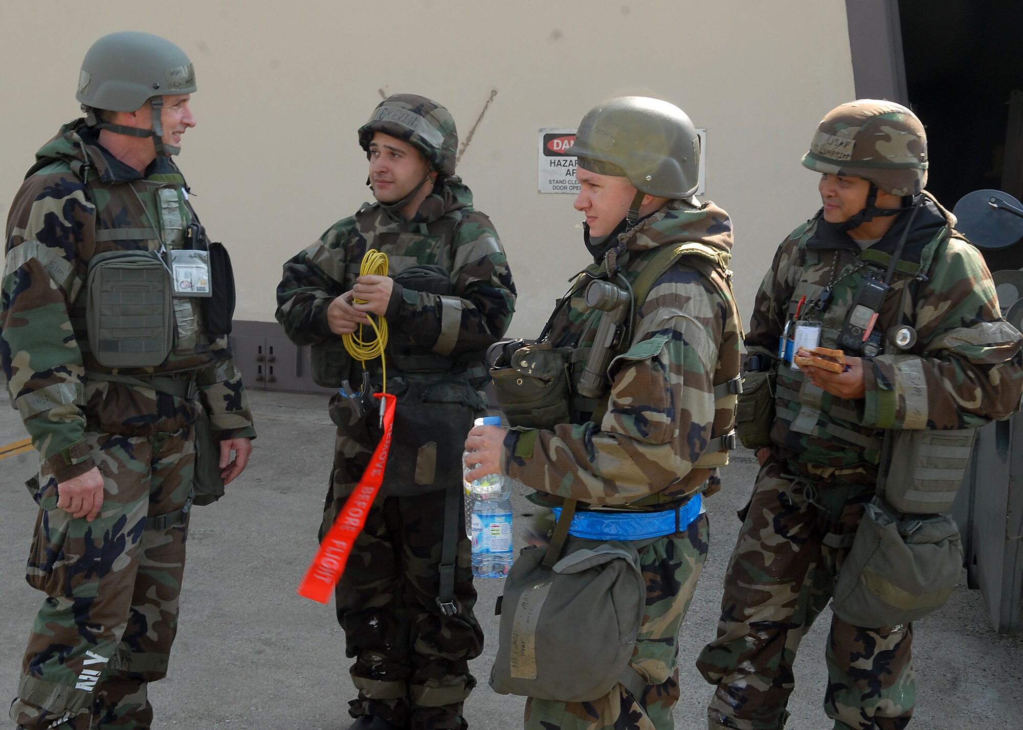 KUNSAN AIR BASE, Republic of Korea -- Maj. Timothy Porter, 8th Fighter Wing chaplain, speaks with flightline Airmen here during Exercise Beverly Midnight 10-04, Oct. 6, 2010. Major Porter went around the flightline giving out refreshments and words of encouragement to flightline Airmen. (U.S. Air Force photo/Senior Airman Ciara Wymbs)