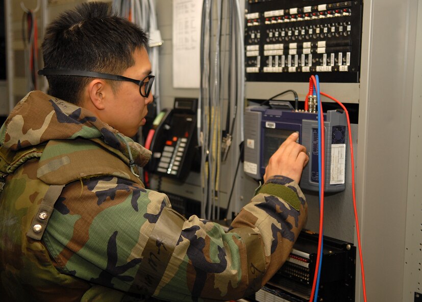 KUNSAN AIR BASE, Republic of Korea -- Senior Airman Emerson Kim, 8th Communications Squadron cyber transport technician monitors non secure internet protocol routers here during Exercise Beverly Midnight 10-04, Oct. 6, 2010. During the exercise Airmen demonstrate their ability to complete the mission in various combat environments and scenarios. (U.S. Air Force photo/Senior Airman Ciara Wymbs) 