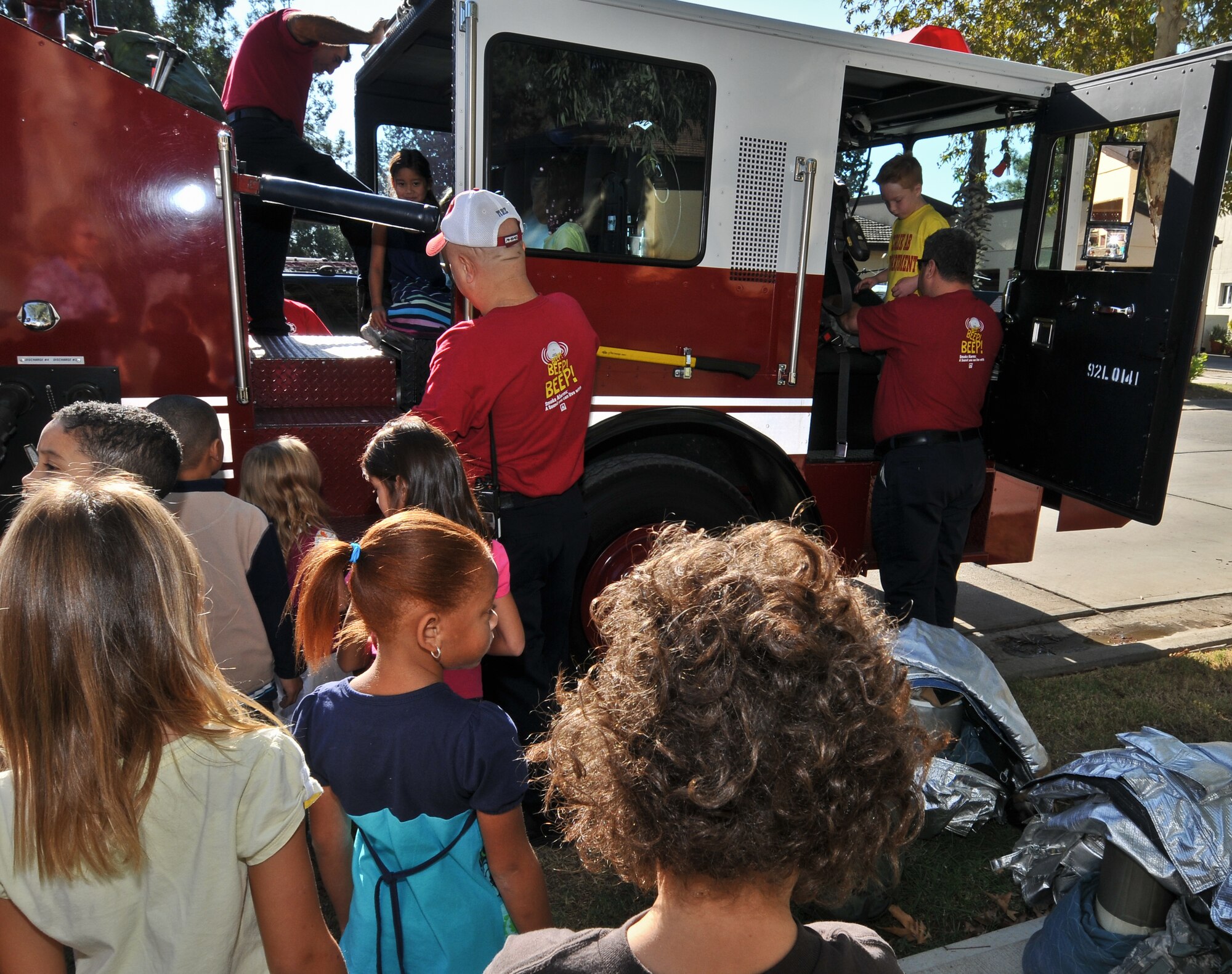 Firefighters with the 39th Civil Engineer Squadron Fire Department give Incirlik Unit School first graders a tour of a fire truck at Sparky’s House Oct. 6, 2010 at Incirlik Air Base, Turkey.   Approximately 250 IUS children visited Sparky’s House to learn fire prevention during Fire Prevention Week 2010.  During the children’s visit, they learned fire safety and prevention through demonstrations and practicing “Stop, Drop and Roll” techniques, smoke detection and safe evacuation. (U.S. Air Force Photo/ Senior Airman Alexandre Montes/Released)