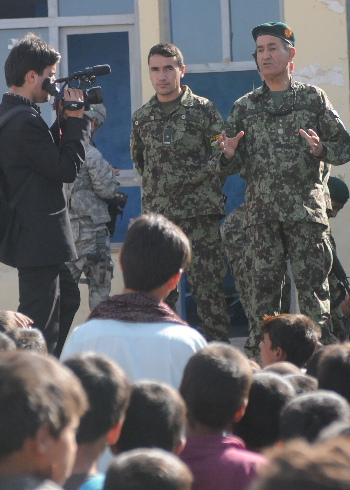 Shindand, Afghanistan – Maj. Gen. Shahzada speaks to the local young males that attend the boys’ school near Shindand Air base about the importance of education. Maj. Gen. Shahzada was one of the key reasons for this mission being able to take place and proceed because he knows that through education will these children, and many more like them, prosper and grow. (U.S. Navy photo by Mass Communication Specialist 3rd Class Jared E. Walker/ RELEASED).